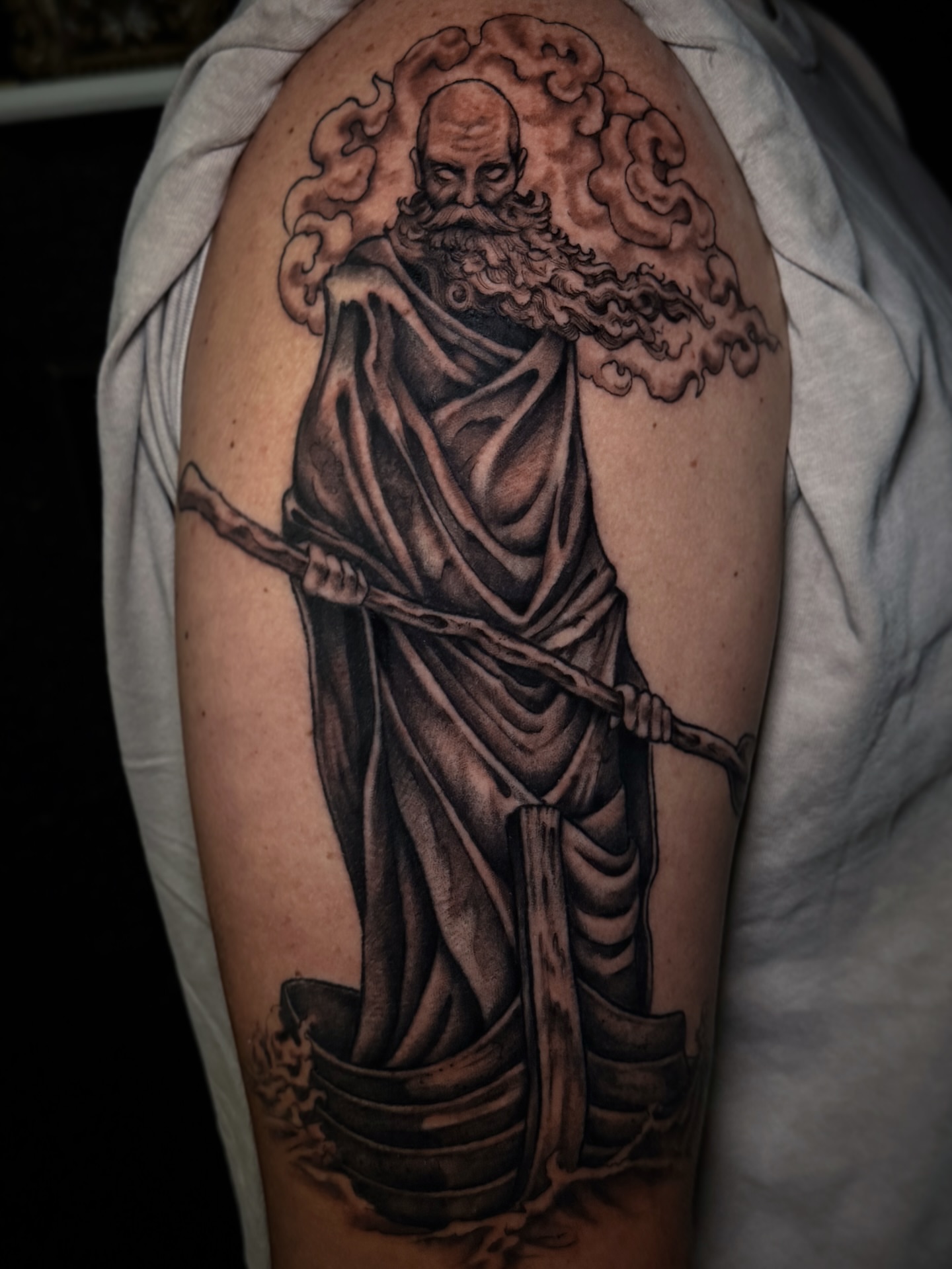Bearded man in robe realism tattoo on the shoulder by Cristen Aro