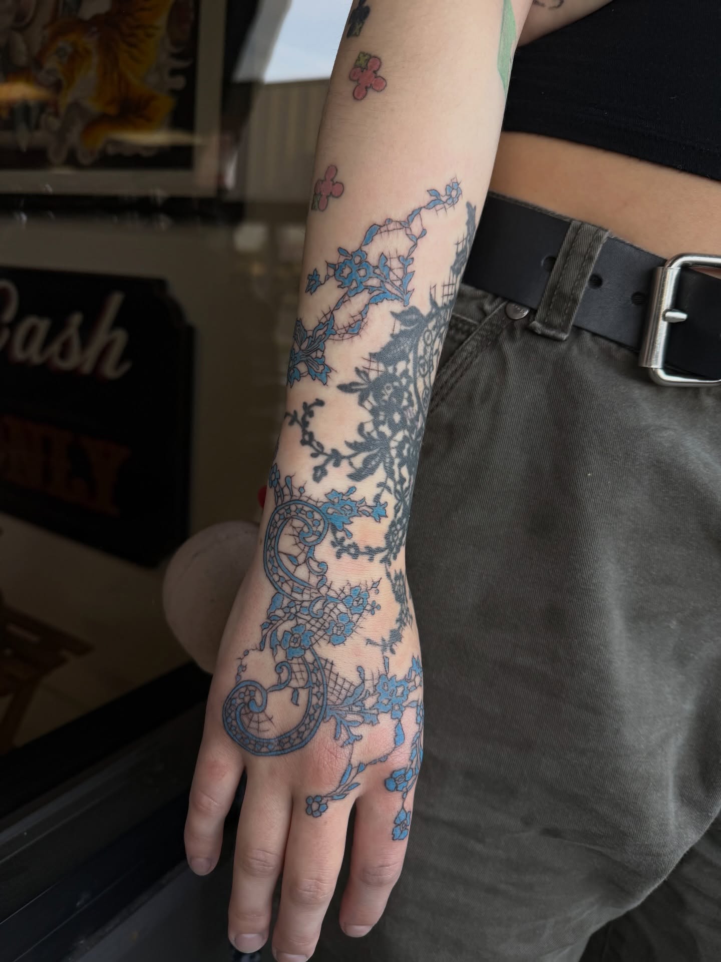 Lacy floral pattern ornamental tattoo on the forearm by Maddie Blosser, Portland, Oregon