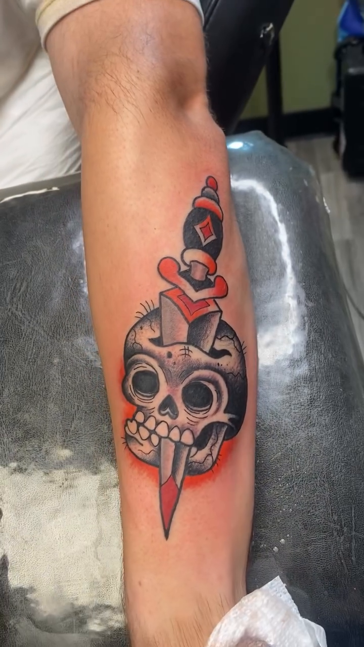 Skull and dagger American traditional tattoo by Aidan Monahan Tattoo