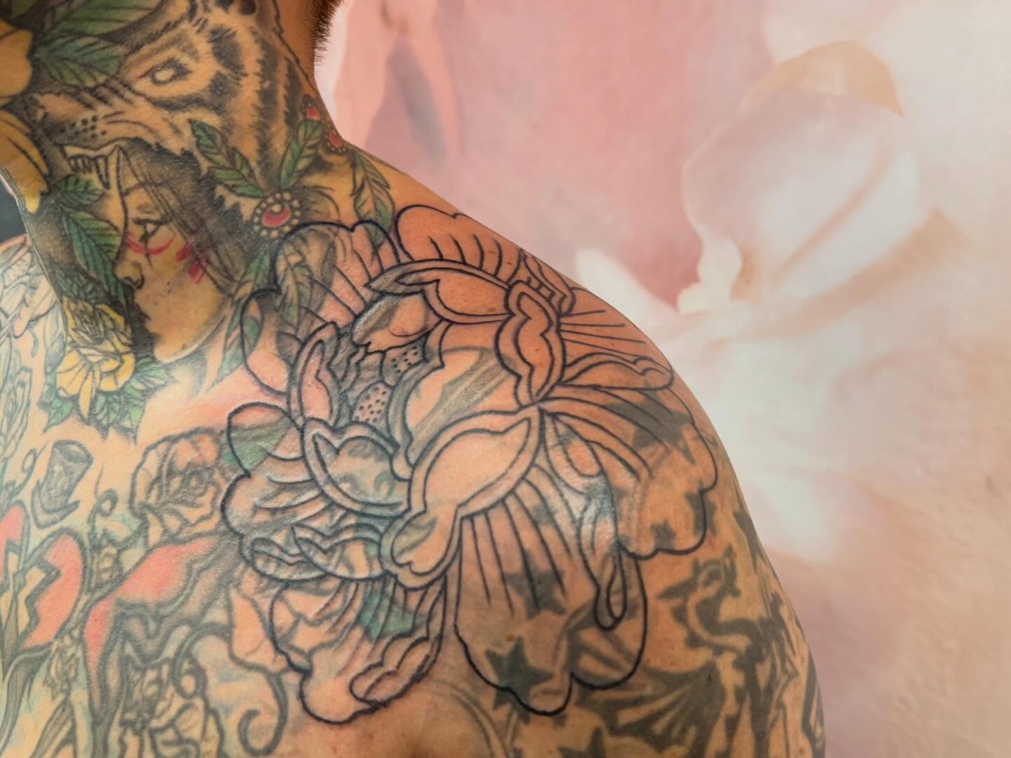 Floral bouquet American traditional tattoo on the back by cortez