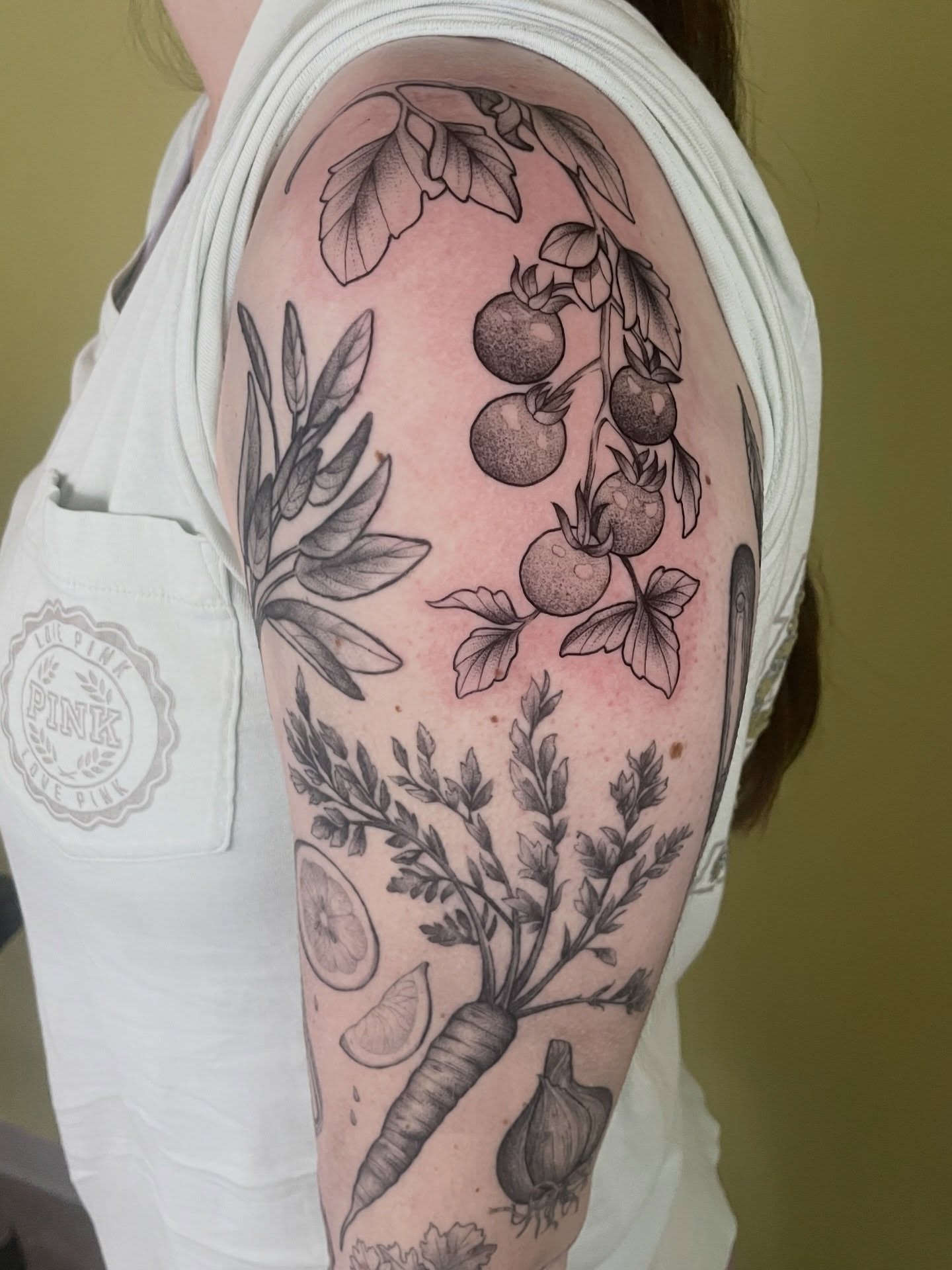 Vegetables and herbs black and grey tattoo on the upper arm by ✨Erin Haines✨