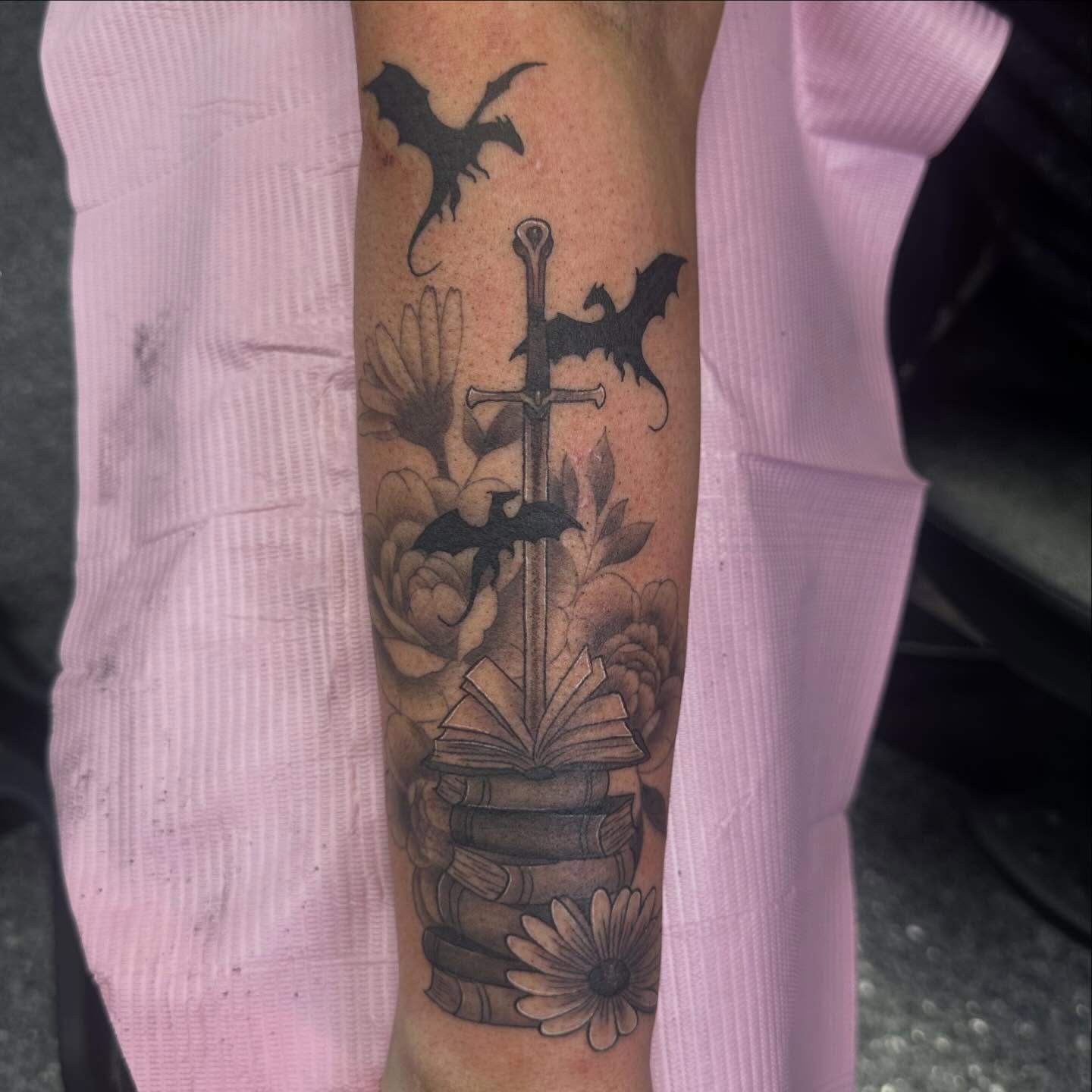 Sword and书籍 black and grey tattoo on the forearm by Victoria Parsons, Clarksville, Indiana