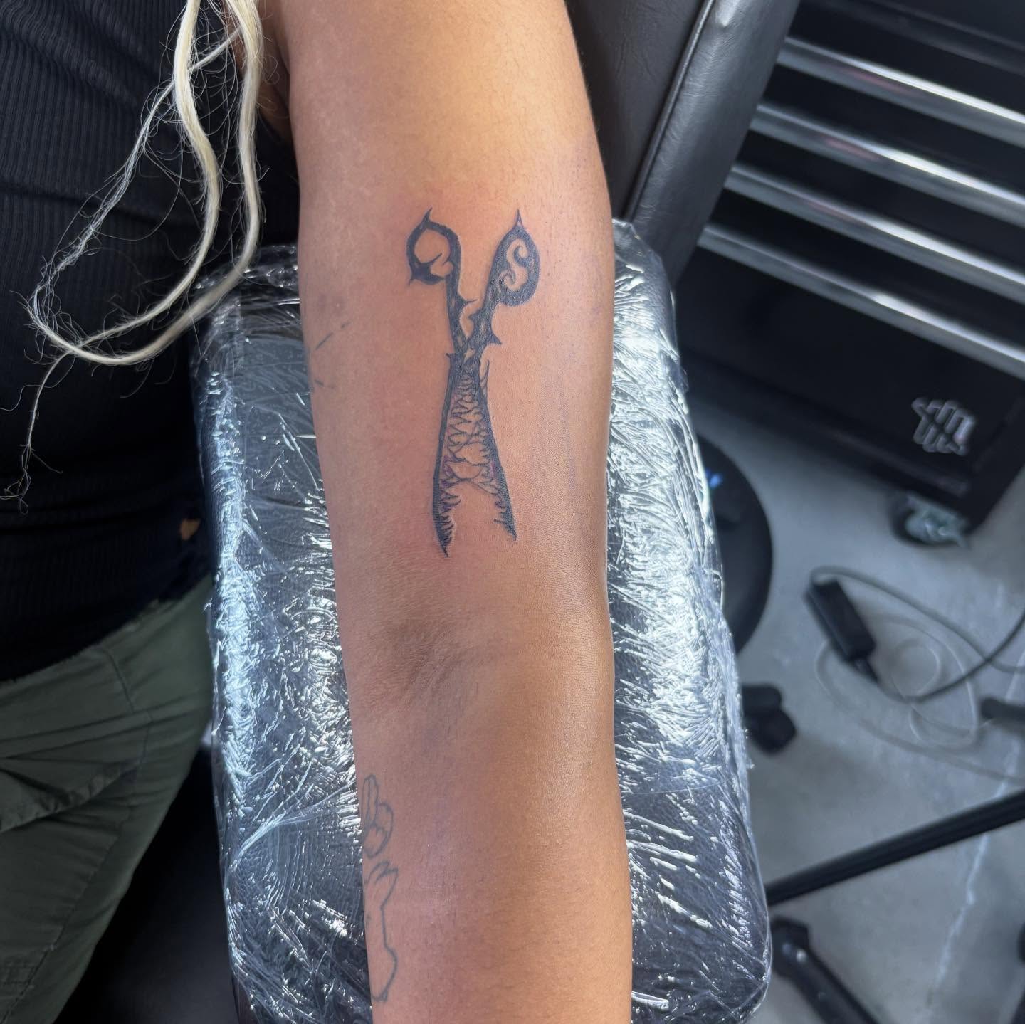 Scissors black and grey tattoo on the forearm by D. Davis