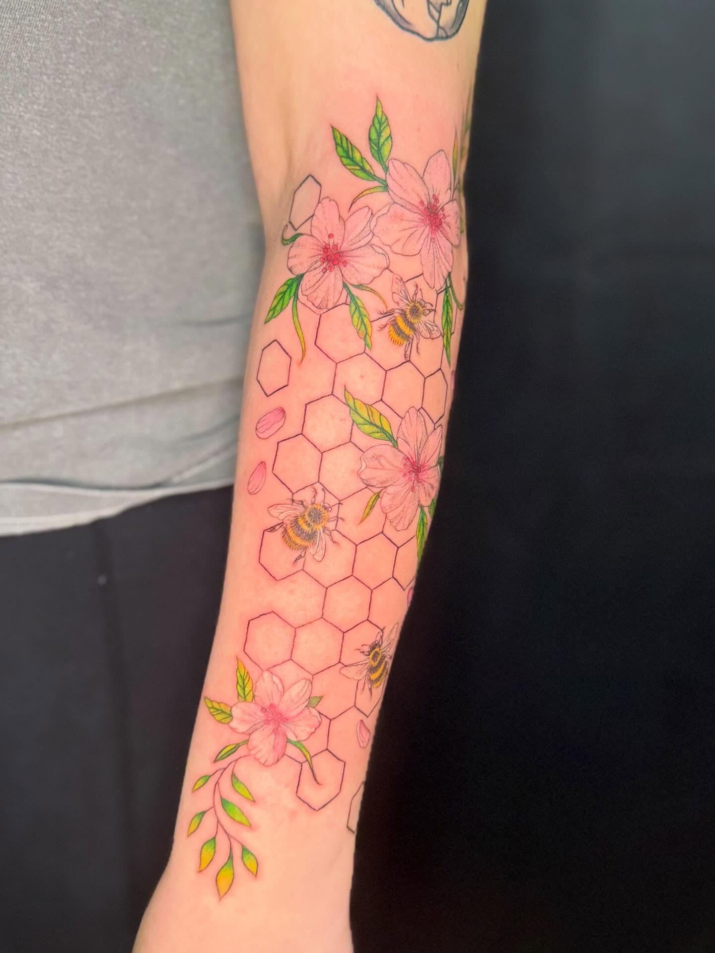 Cherry blossoms and bees geometric tattoo on the forearm by Olivia, Royal Oak, Michigan