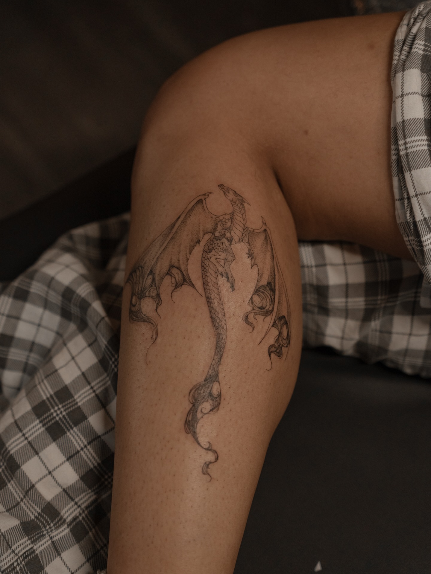 Dragon black and grey tattoo on the thigh by Jen- San Antonio tattoo artist