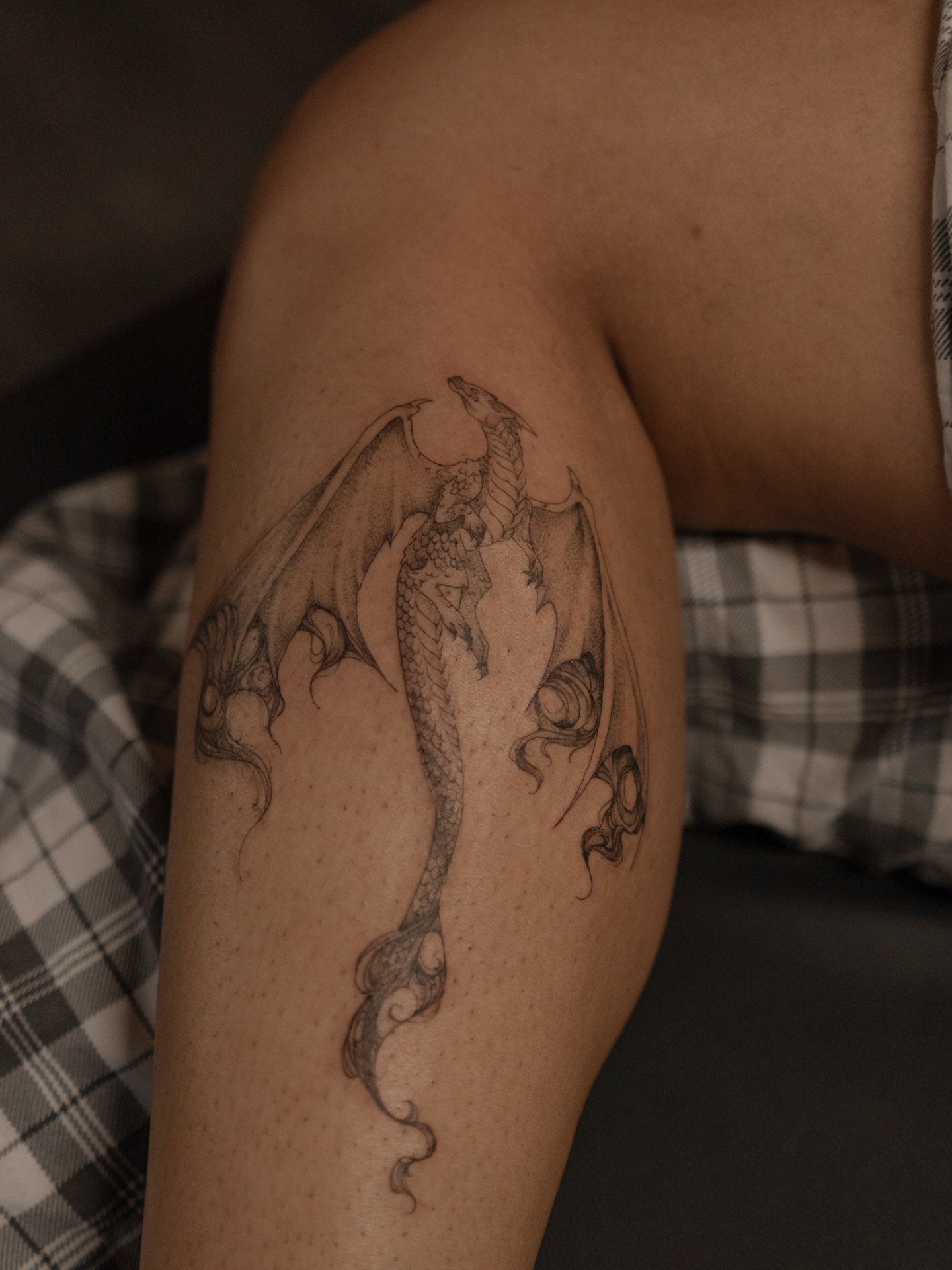 Dragon black and grey tattoo on the thigh by Jen- San Antonio tattoo artist