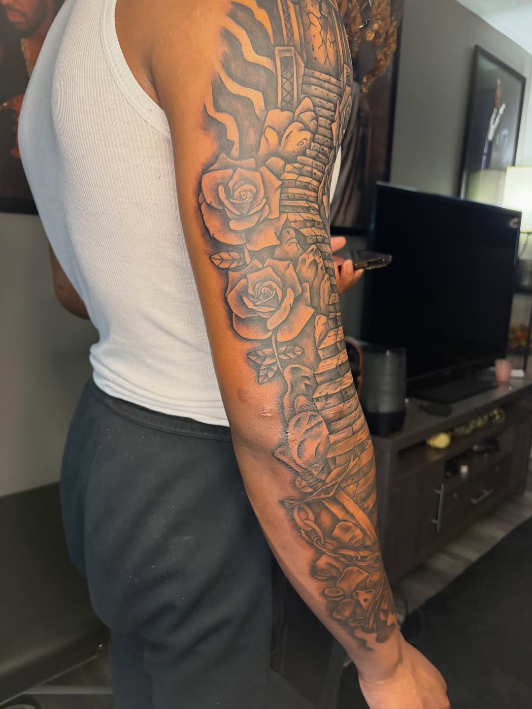 Tattoo by @maleekinkz โ realism, black_and_grey