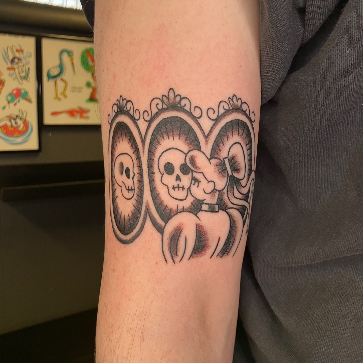 Skulls and Minnie Mouse black and grey tattoo on the forearm by maddie mcghee, Memphis, Tennessee