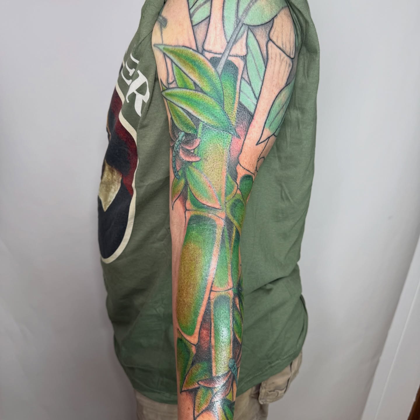Bamboo realism tattoo on the upper arm by autumn sky