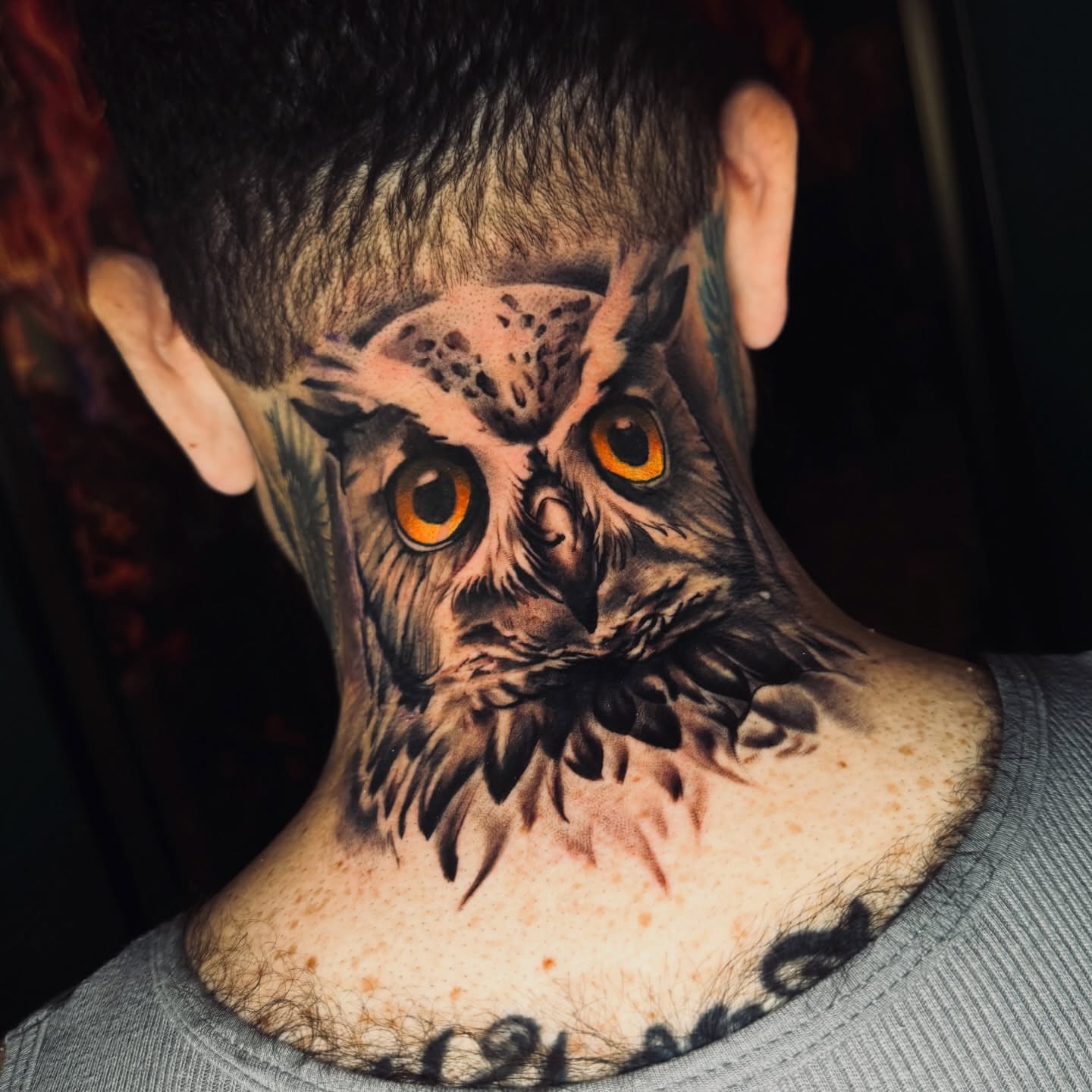 Owl realism tattoo on the neck by Donald Reynolds