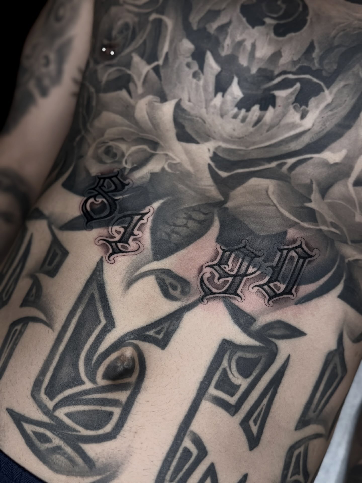 Floral design geometric tattoo on the chest by Emersyn DeLuna