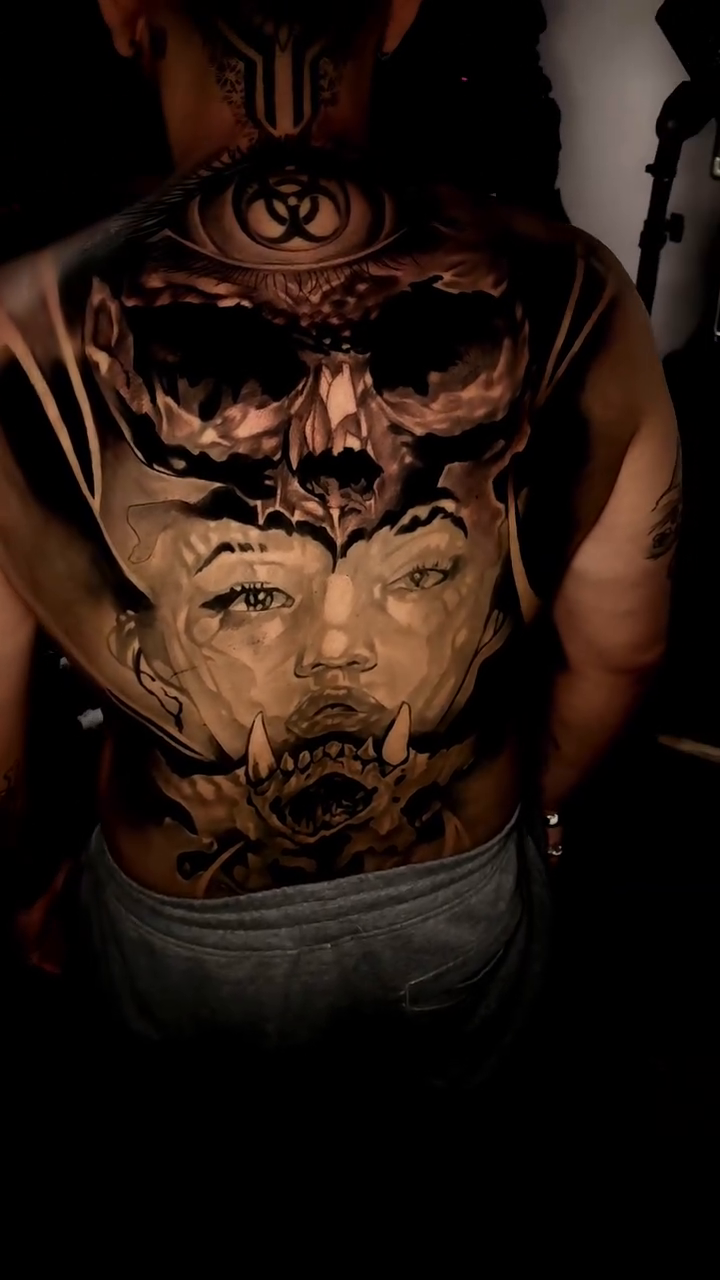Skull and demonic face dark realism tattoo by Xavier NYC TATTOO ARTIST