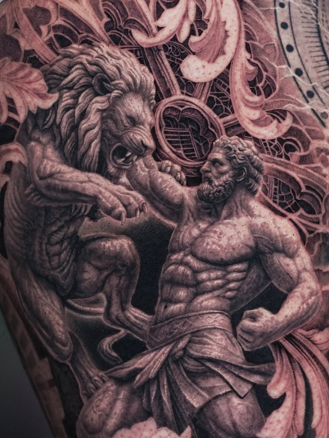 Man fighting lion realism tattoo on the upper arm by Sumok Kim