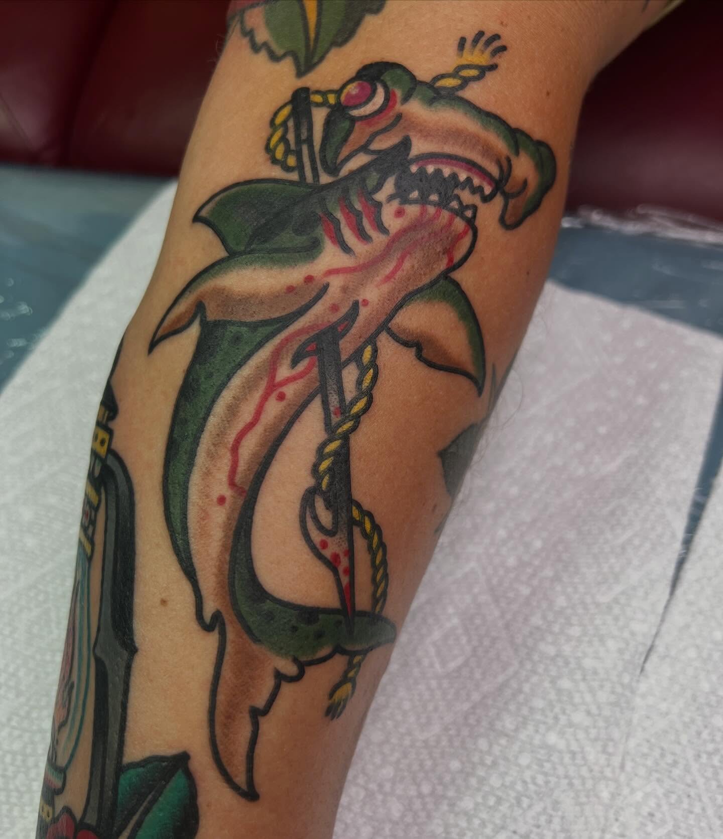 Shark with anchor American traditional tattoo on the forearm by Steven Blackheart