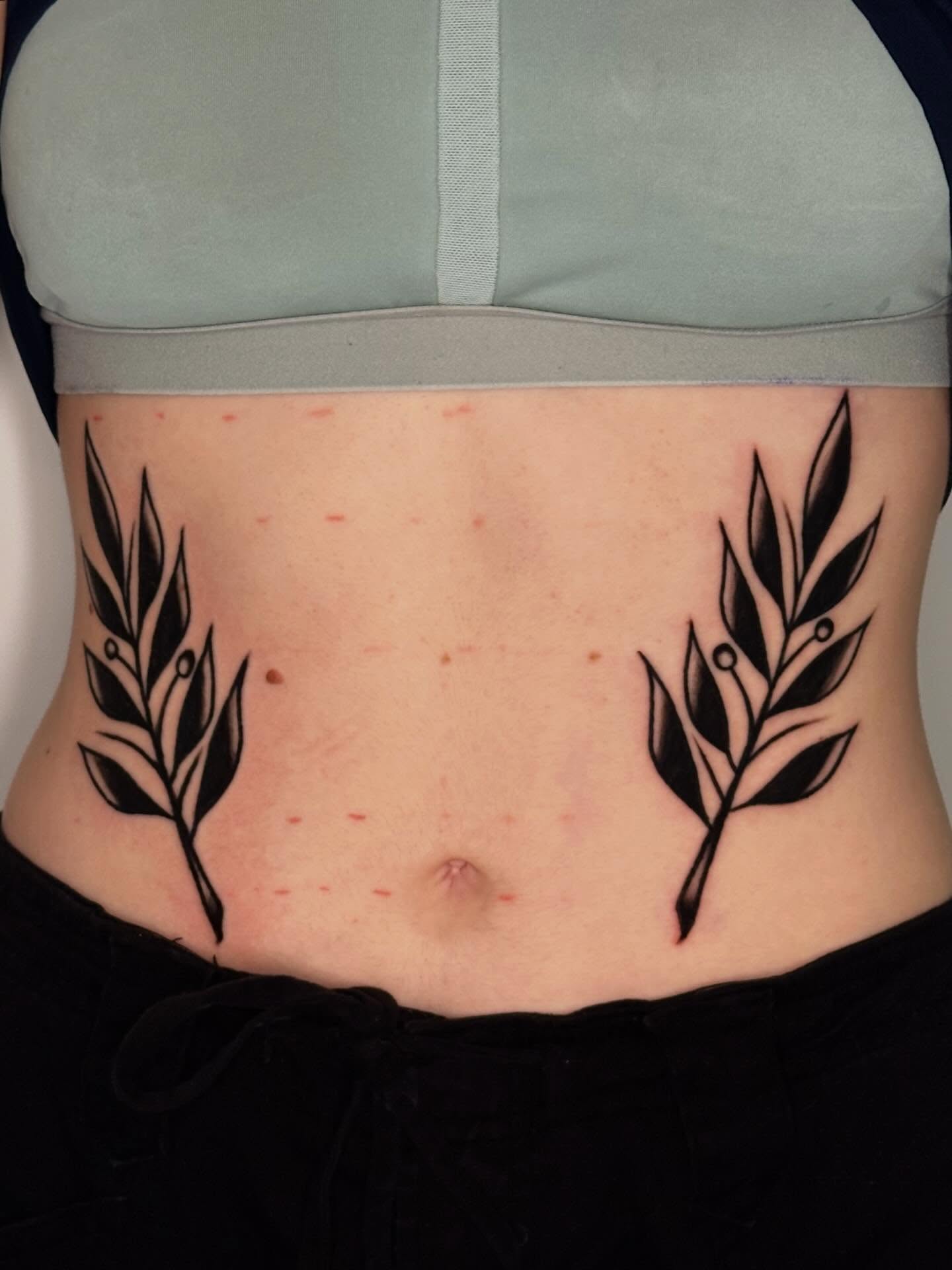 Olive branch black and grey tattoo on the torso by 쿤타