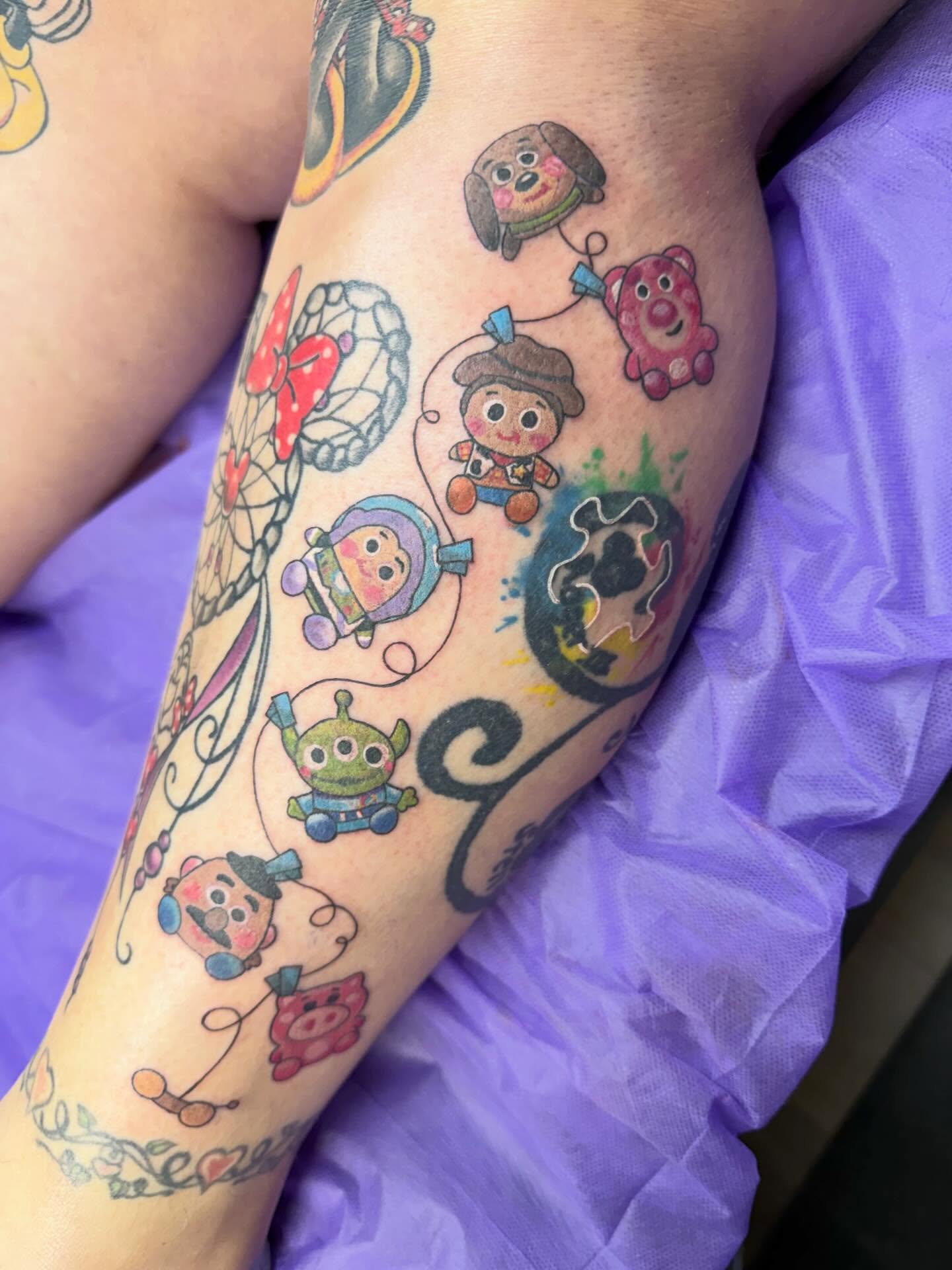 Disney characters watercolor tattoo on the forearm by Tina Gregg, North Ridgeville, Ohio