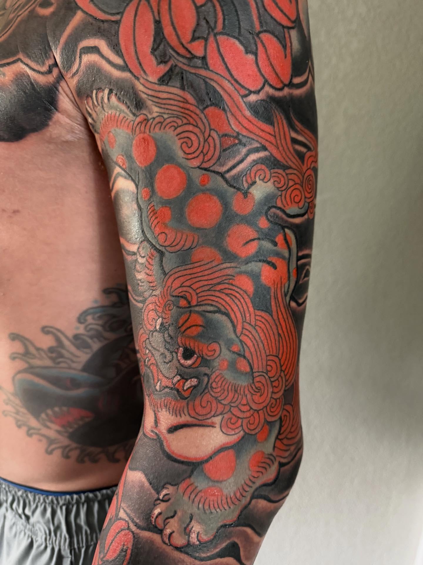 Lion japanese irezumi tattoo on the forearm by Randall Croley El