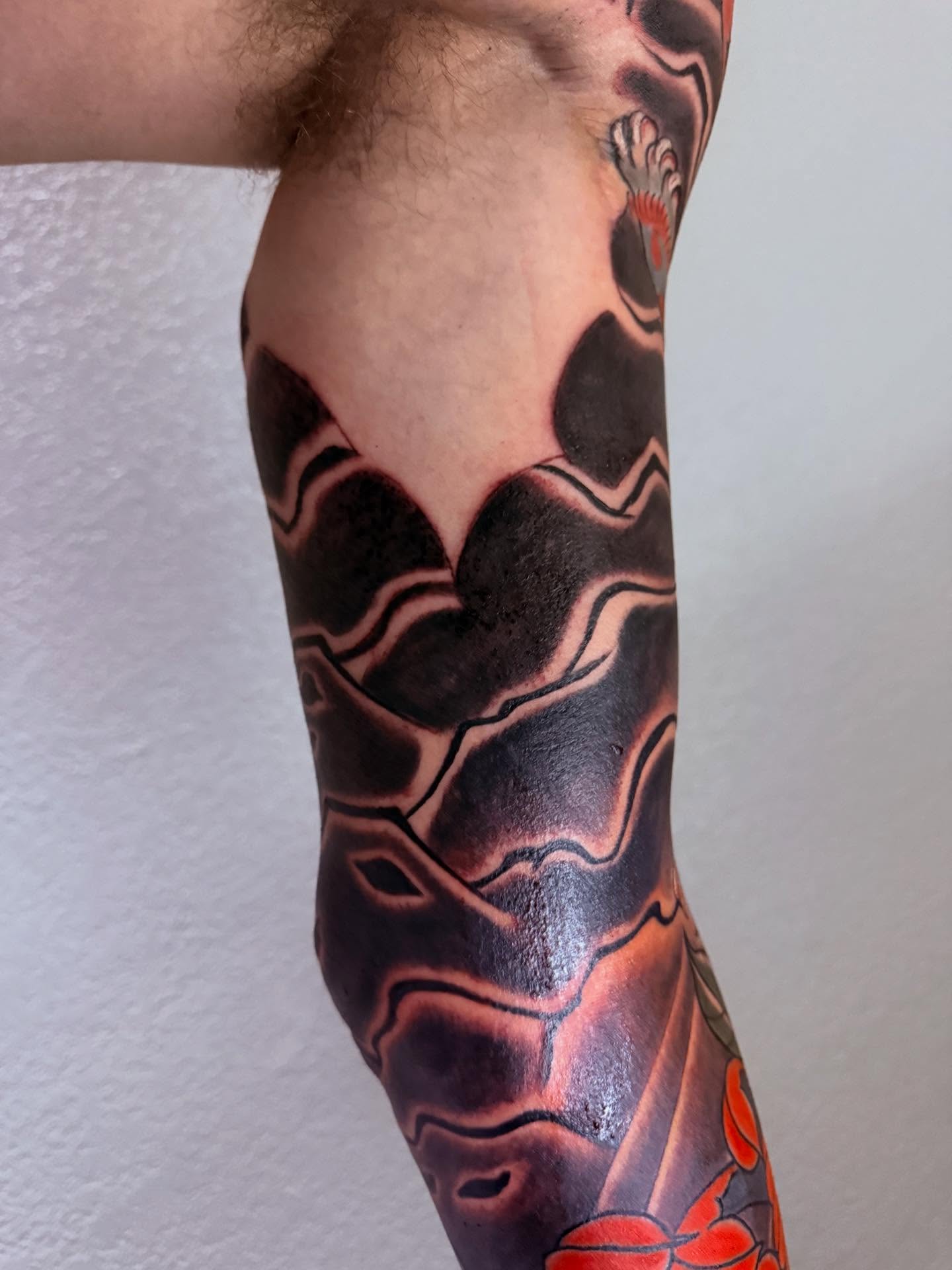 Abstract waves geometric tattoo on the forearm by Randall Croley El
