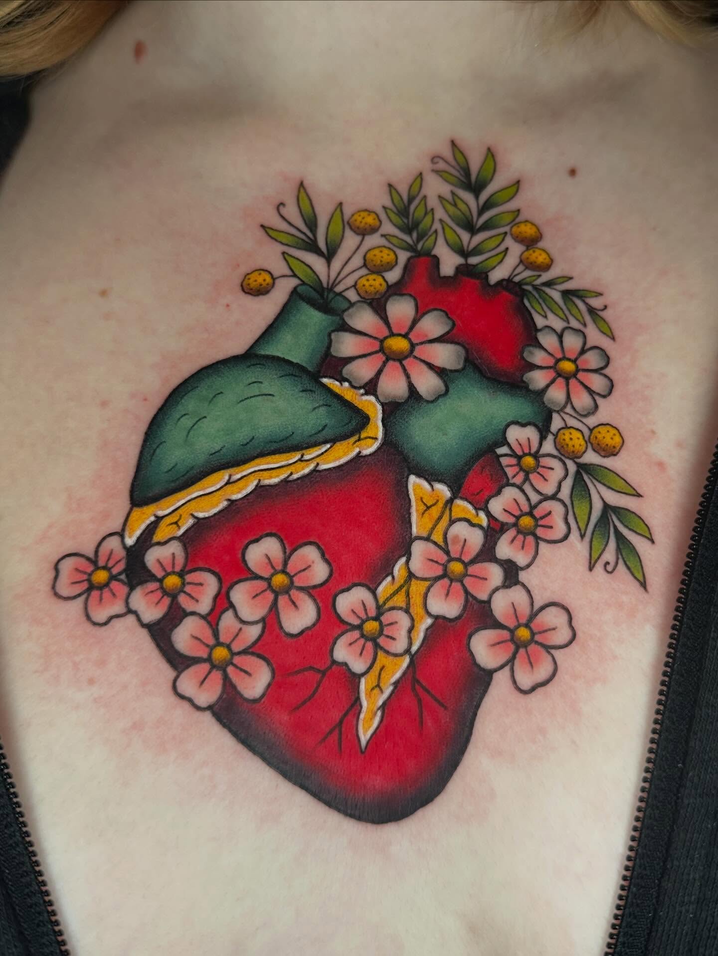 Anatomical heart with flowers American traditional tattoo on the chest by ♥︎ ᴅᴇᴠ ʀᴇɴᴇᴇ ♥︎