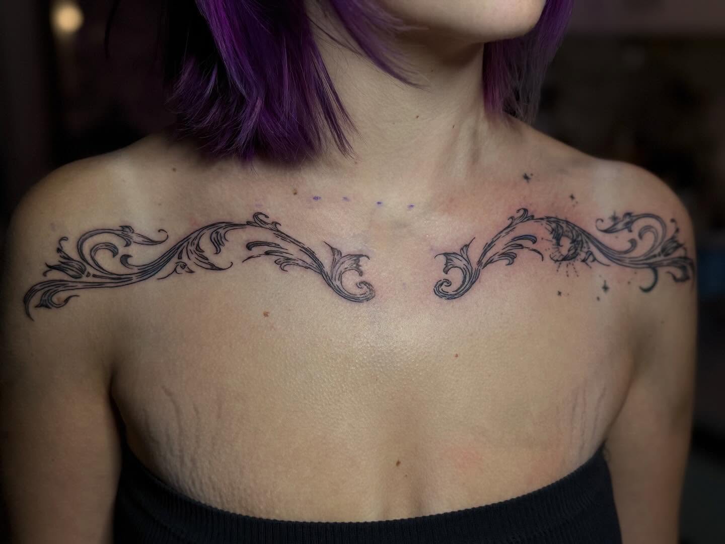 Scrollwork ornamental tattoo on the chest by Cullen-Lee