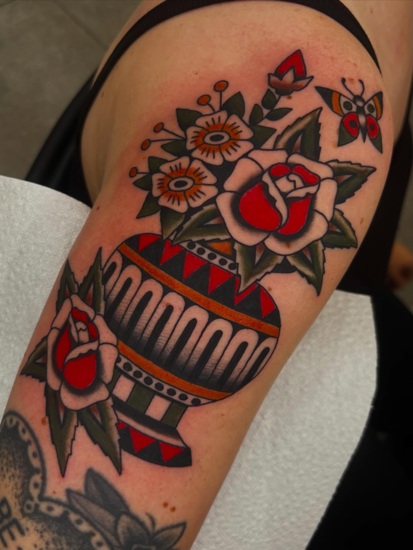 Flower basket American traditional tattoo on the forearm by Claire Anderson