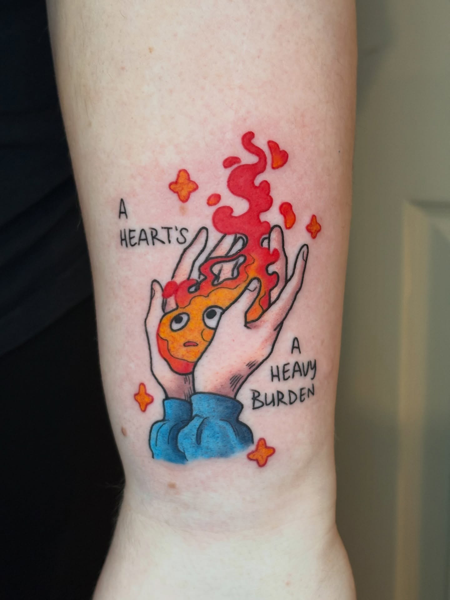 Flaming heart watercolor tattoo on the forearm by Callum