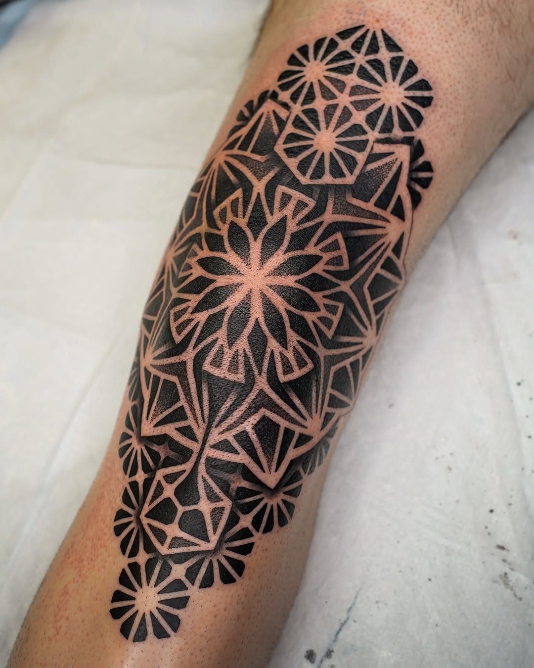 Tattoo by @rjxdots — geometric, blackwork