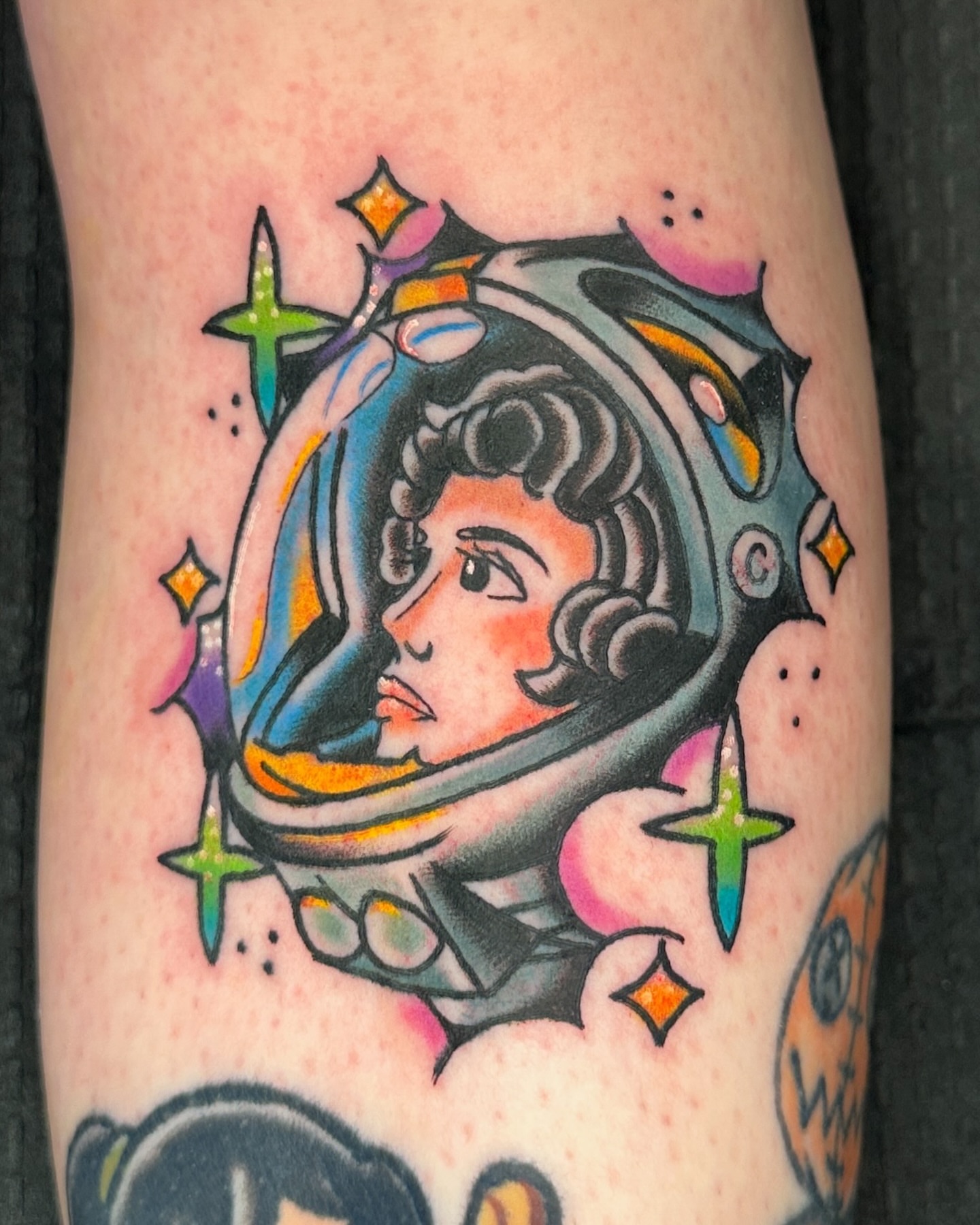 Astronaut helmet American traditional tattoo on the forearm by Paige Ochoa