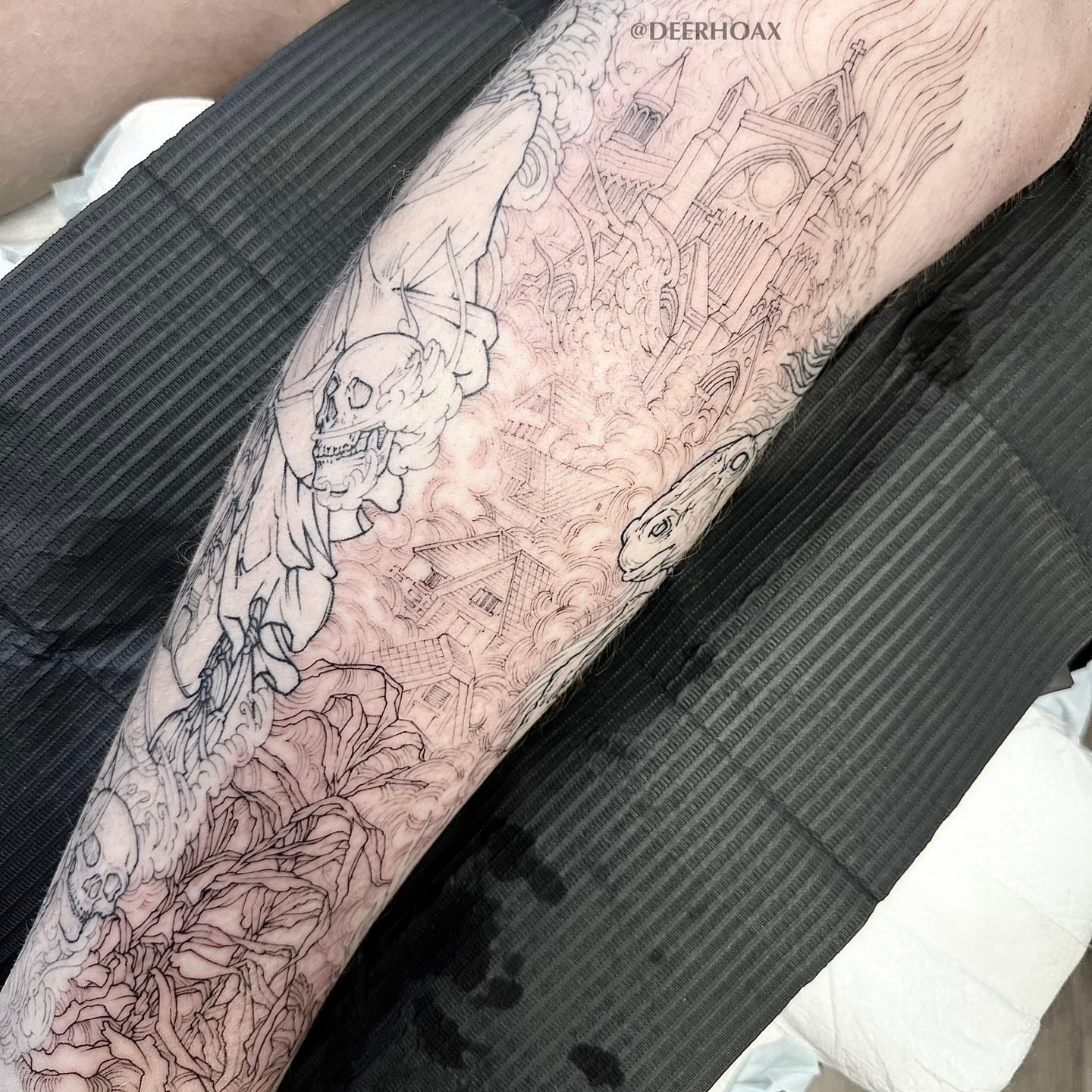 Cityscape with skulls realism tattoo on the forearm by Mary "Baby Hands" Kulvete