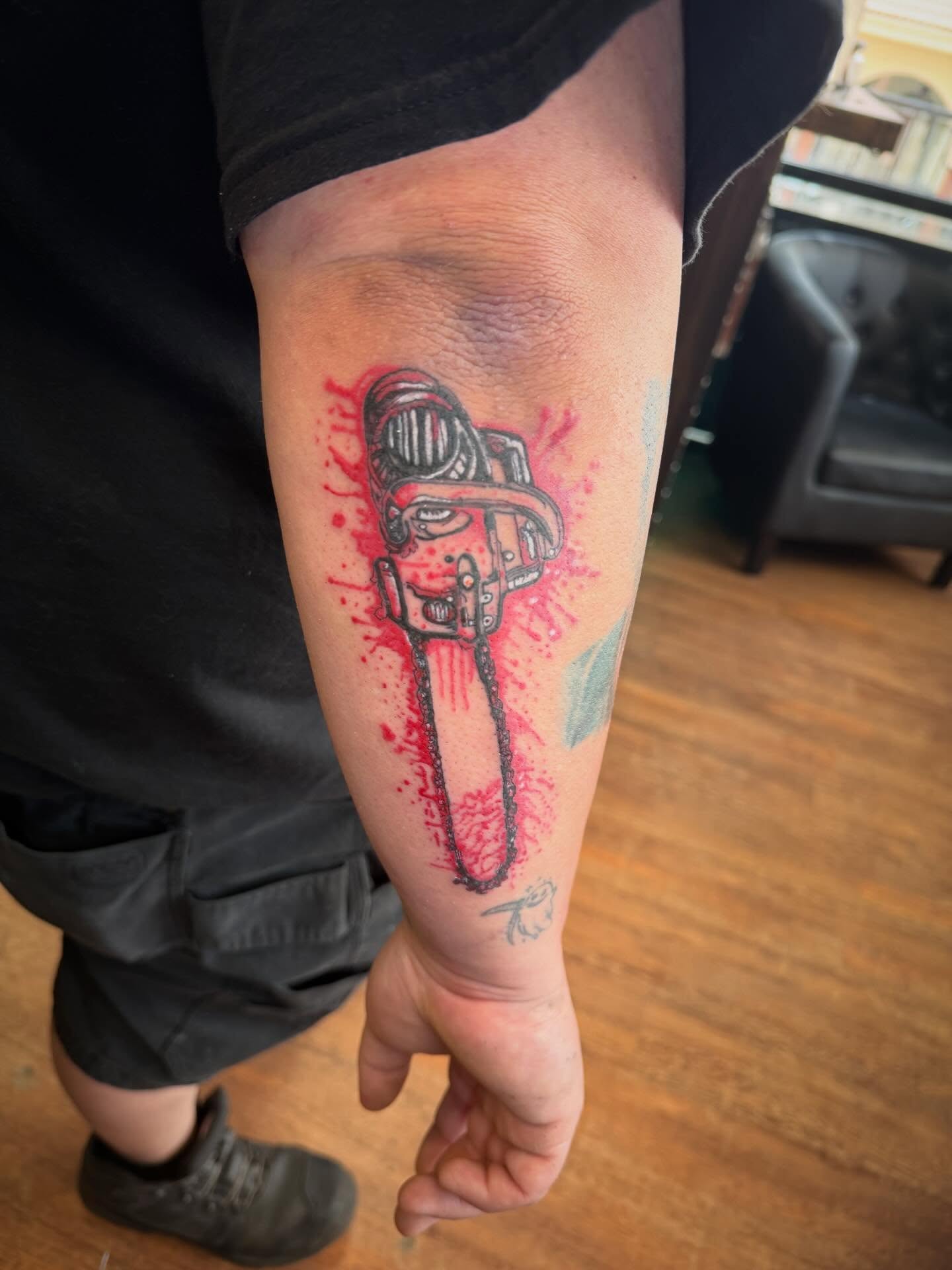 Chainsaw realism tattoo on the forearm by Mikey