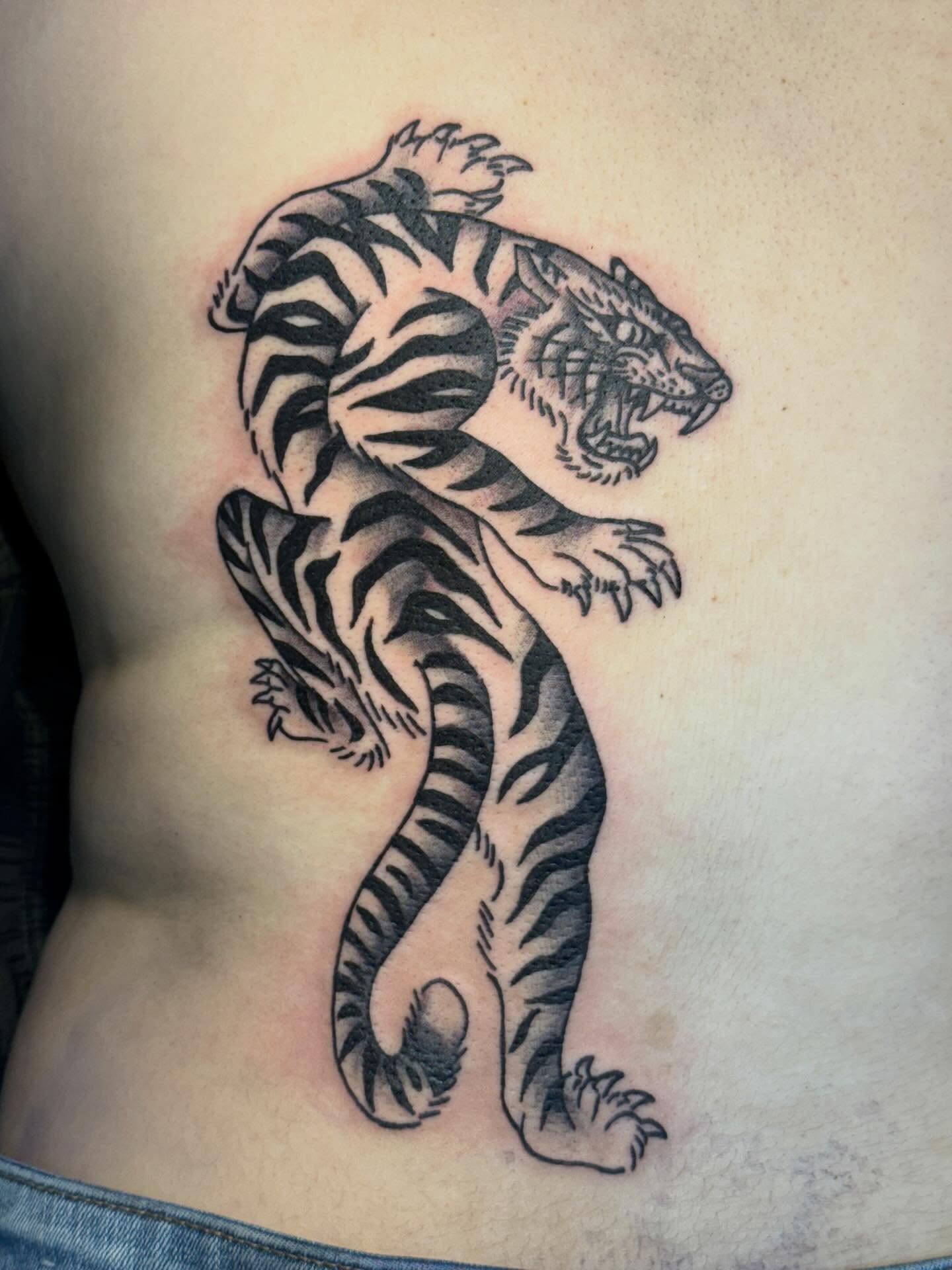 Tiger black and grey tattoo on the ribs by CAT