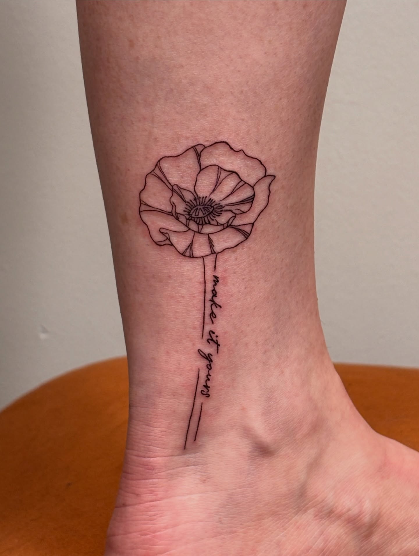 Poppy flower fine line tattoo by Maddie
