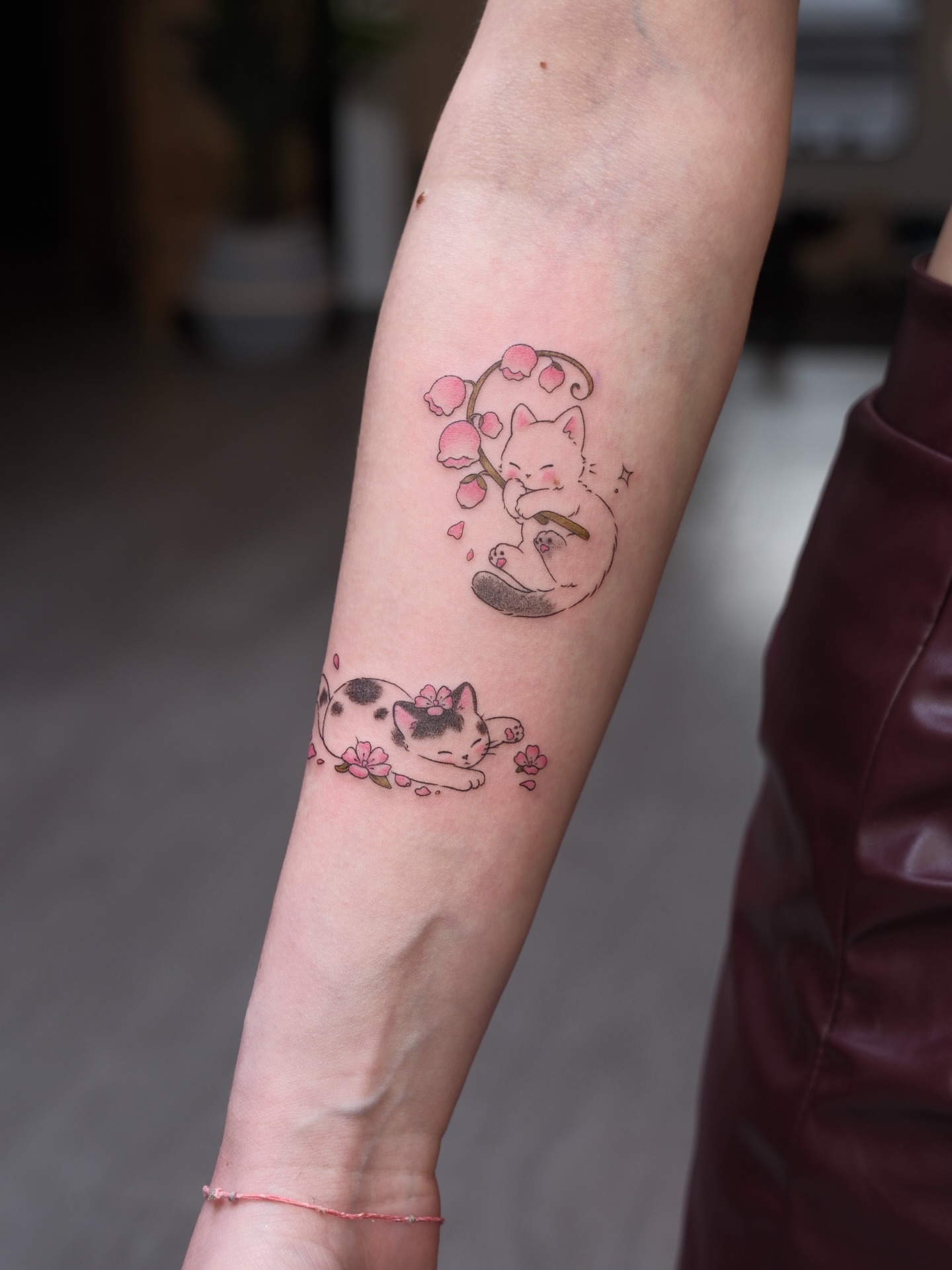 Cherry blossom cats dotwork tattoo on the forearm by Alina 🌙 Tattoo in Calgary 🇨🇦