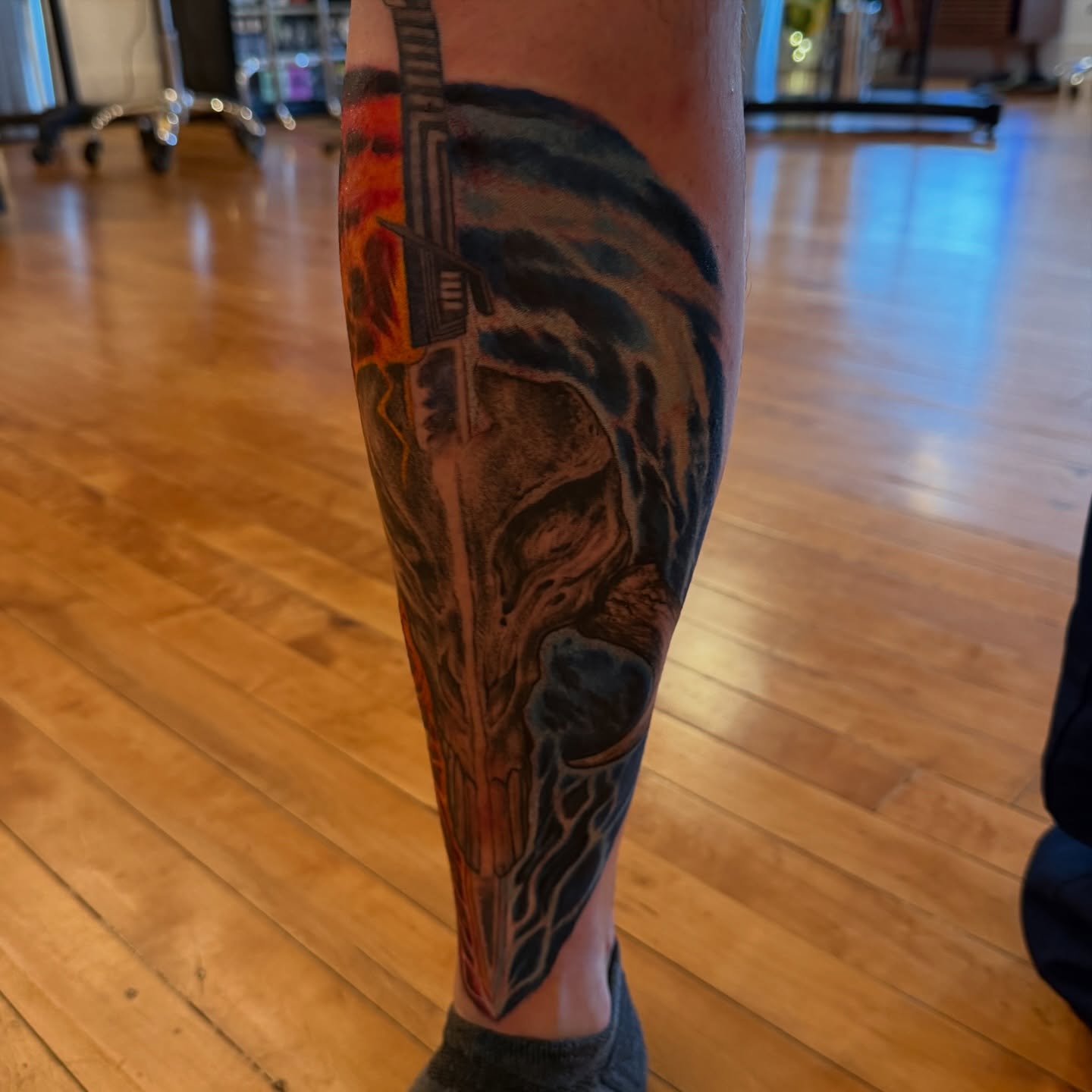 Cyborg head dark realism tattoo on the calf by steven