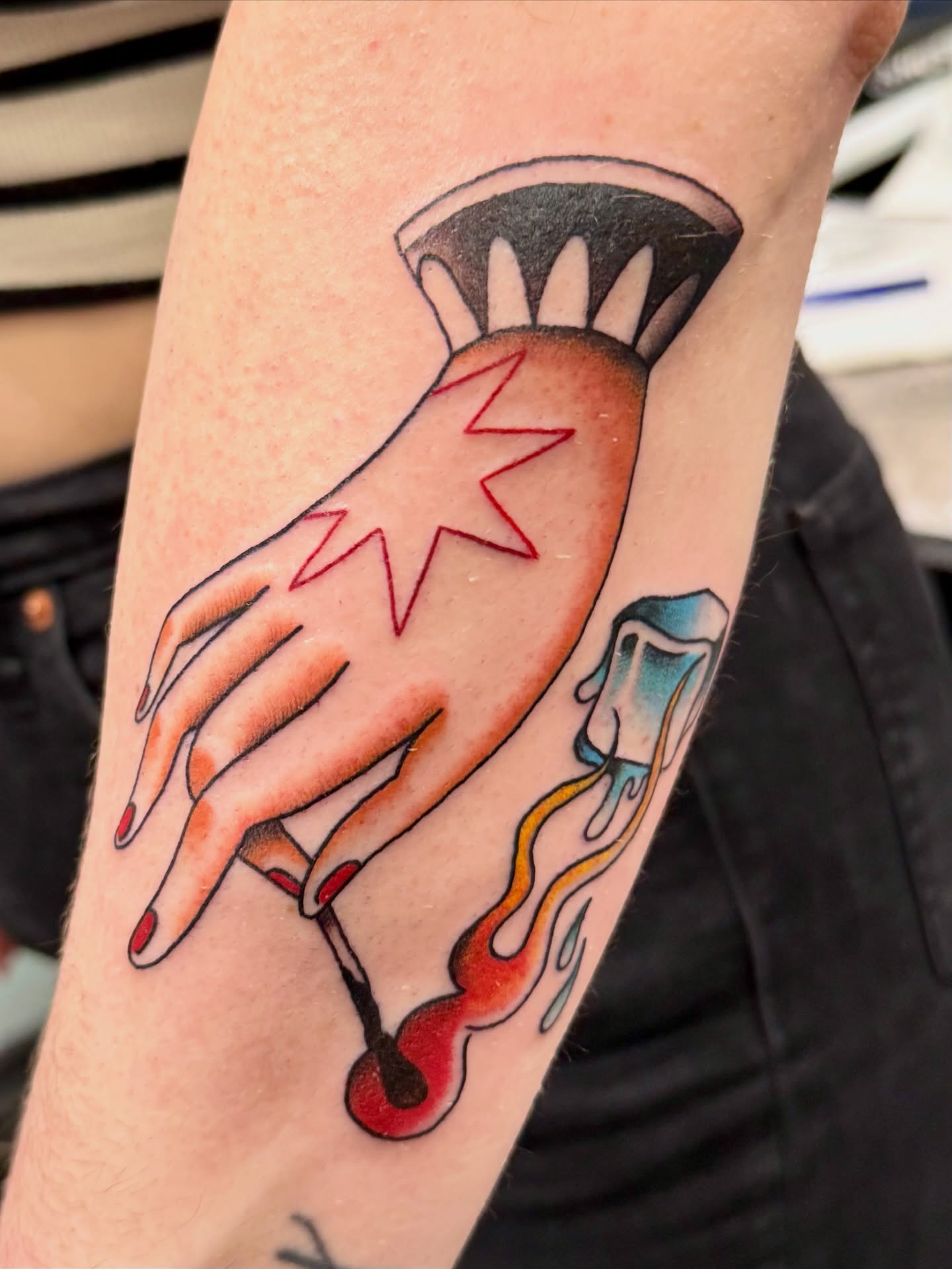 Burning hand American traditional tattoo on the forearm by Sophie McTear