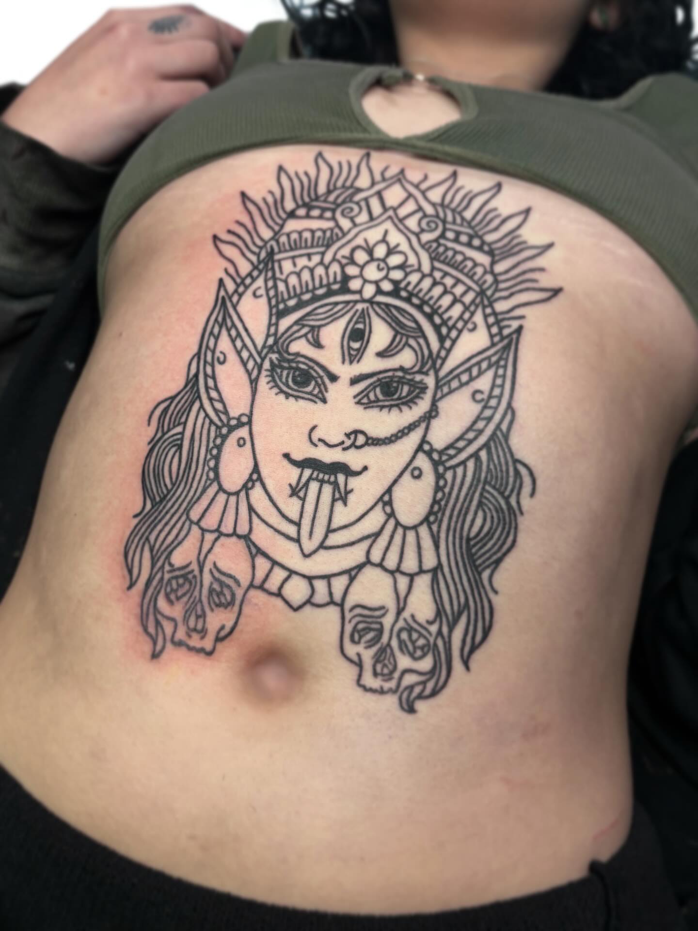 Demoness black and grey tattoo on the ribs by Ava Brady Tattoos