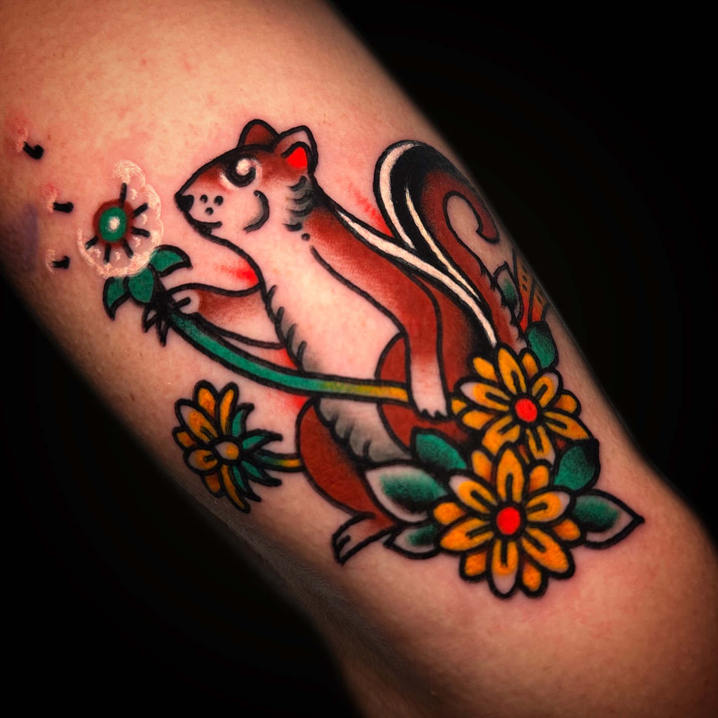 Chipmunk and flowers American traditional tattoo on the forearm by Danny Reis