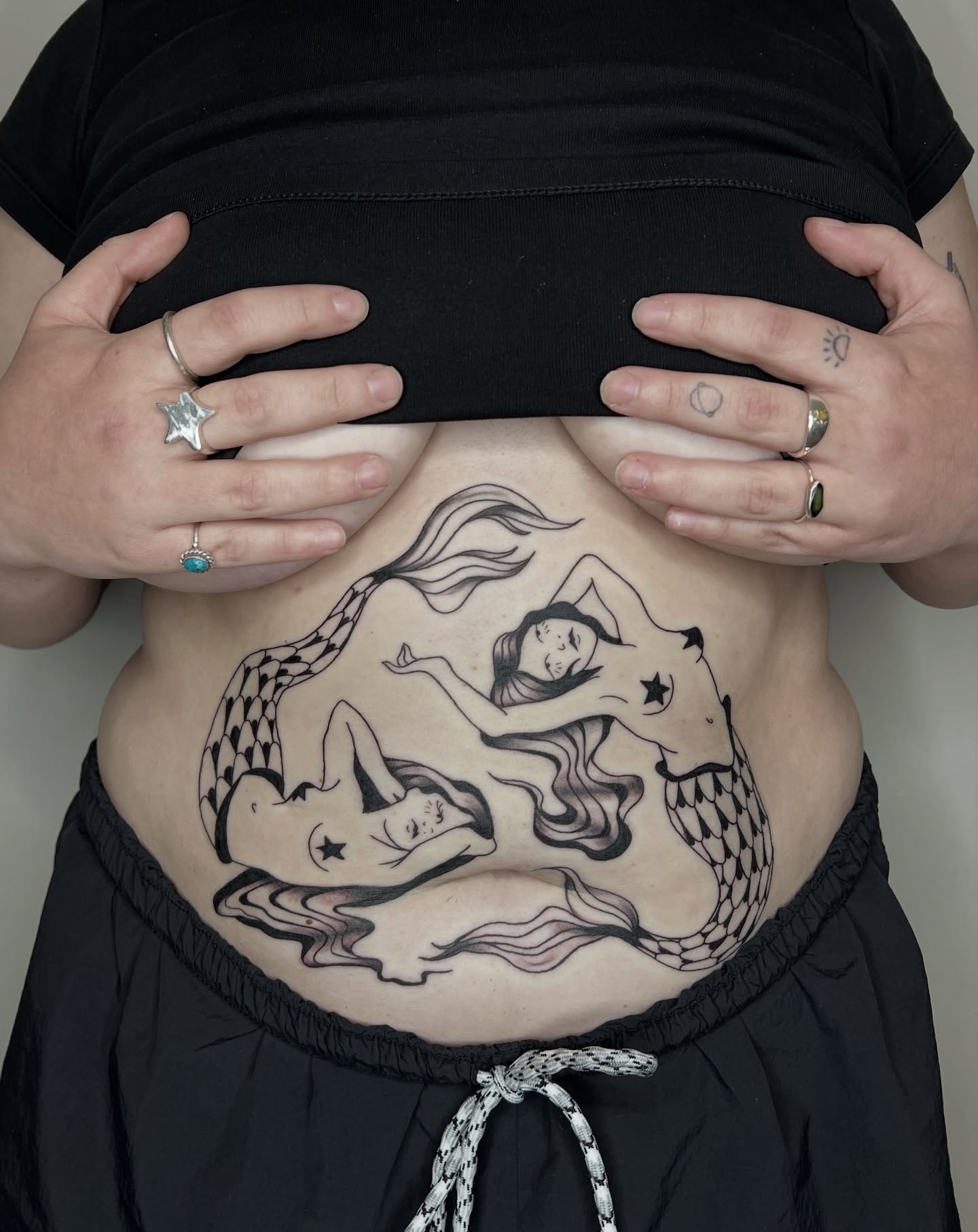 Mermaids black and grey tattoo on the torso by Elleree (LRE)