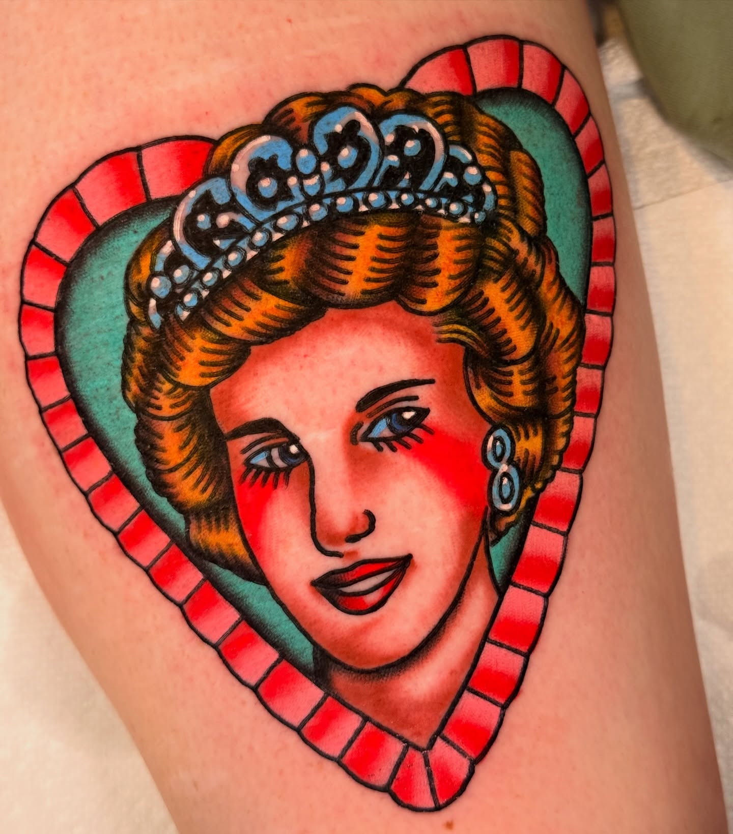 Royal portrait American traditional tattoo on the thigh by {{Theo Glanton}}