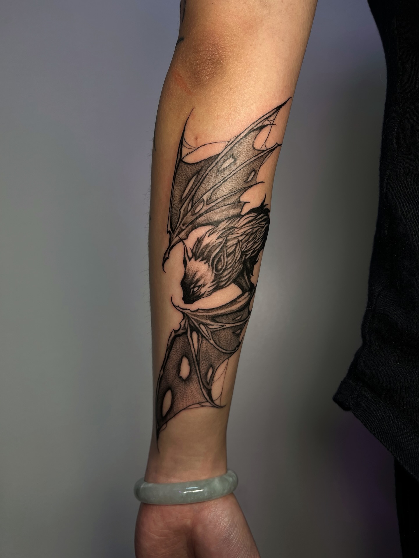 Winged creature dotwork tattoo on the forearm by MK