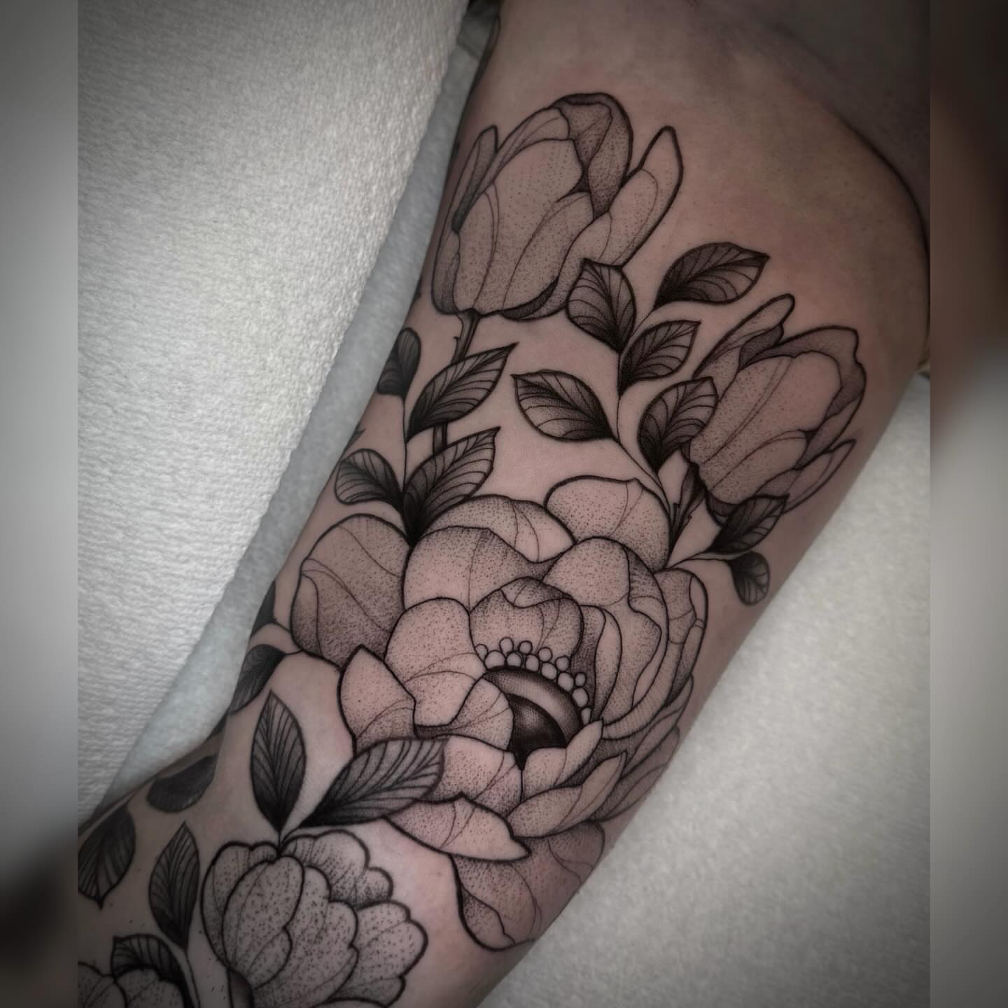 Peony flowers dotwork tattoo on the forearm by Alyssa Deeghan