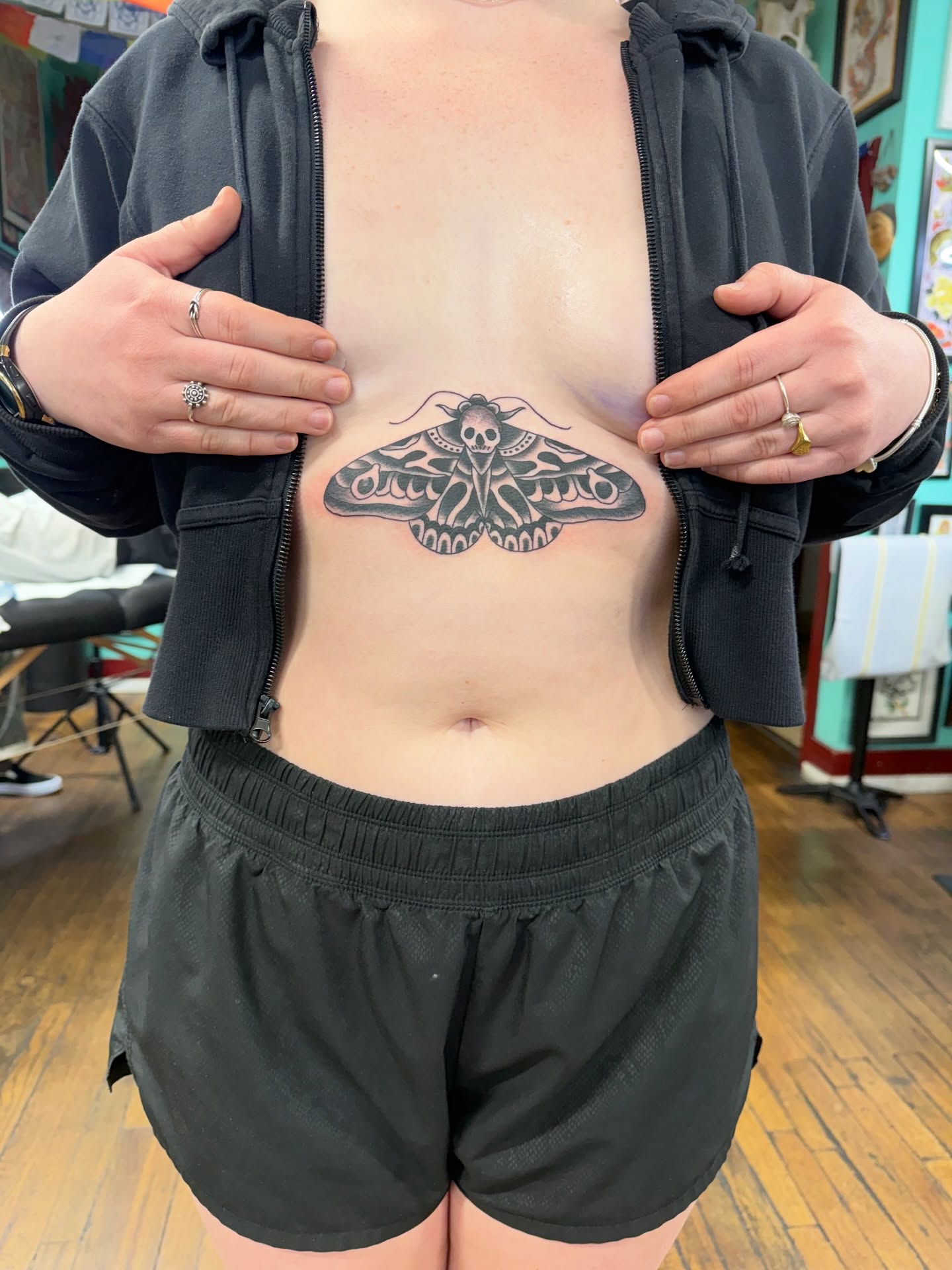 Moth black and grey tattoo on the torso by Aaron ulfstam