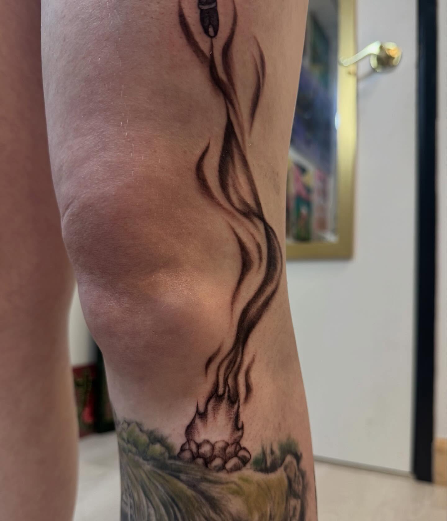 Campfire and smoke black and grey tattoo on the forearm by Gigi