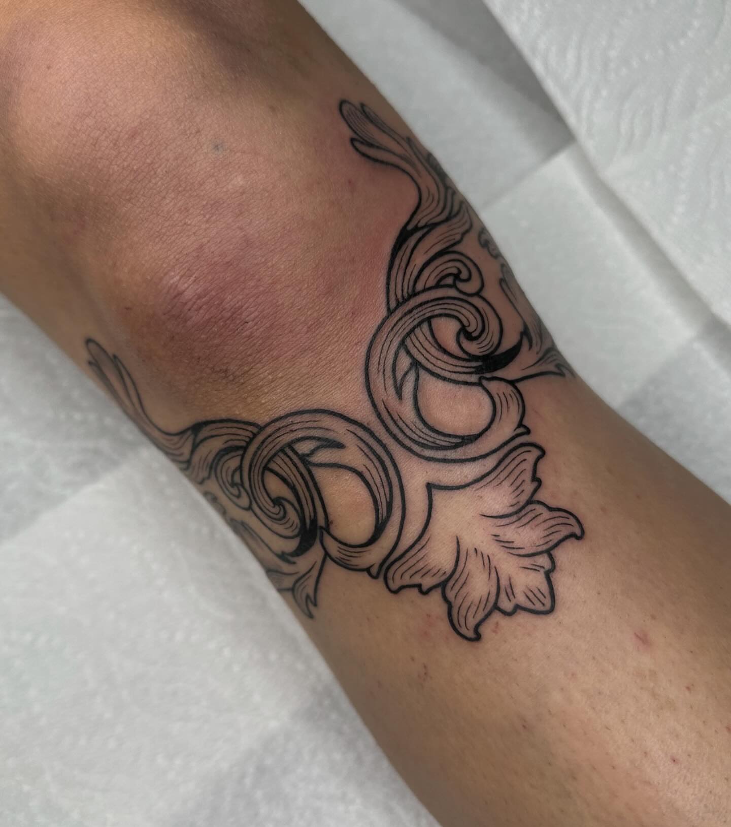Scrollwork black and grey tattoo on the forearm by Aleksandra
