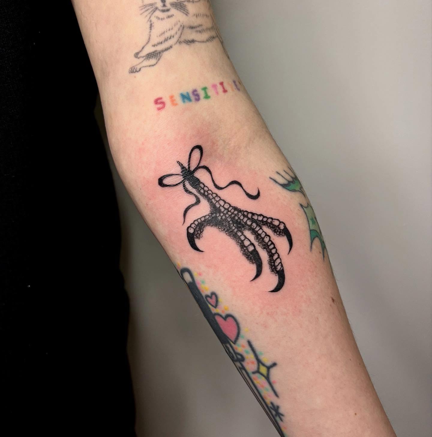 Octopus tentacle black and grey tattoo on the forearm by kendle