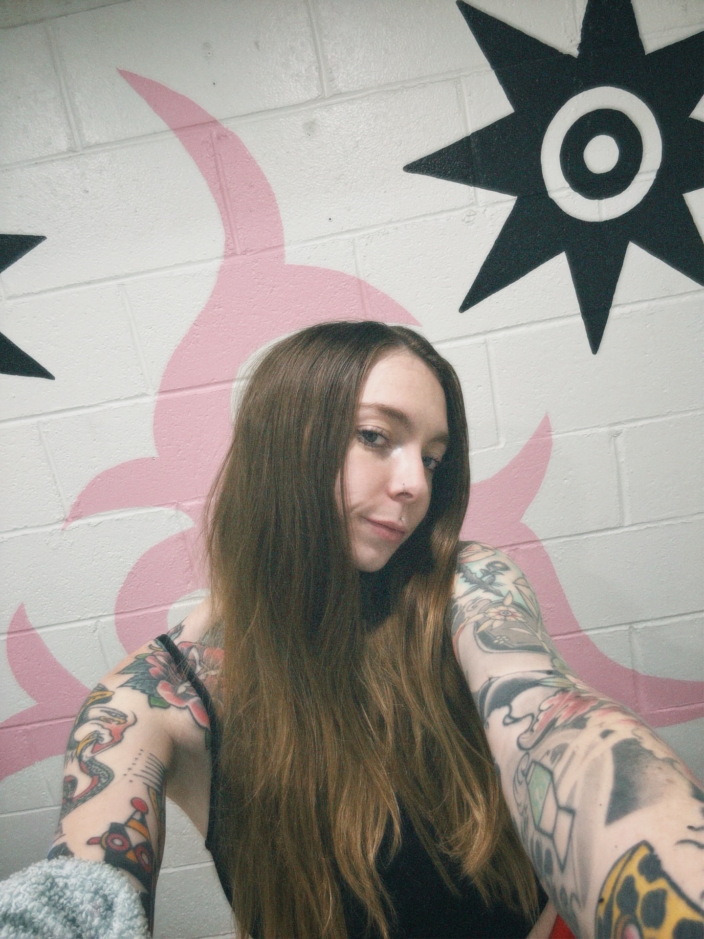 Floral and snake American traditional tattoo on the upper arm by lily gustave i tattoo
