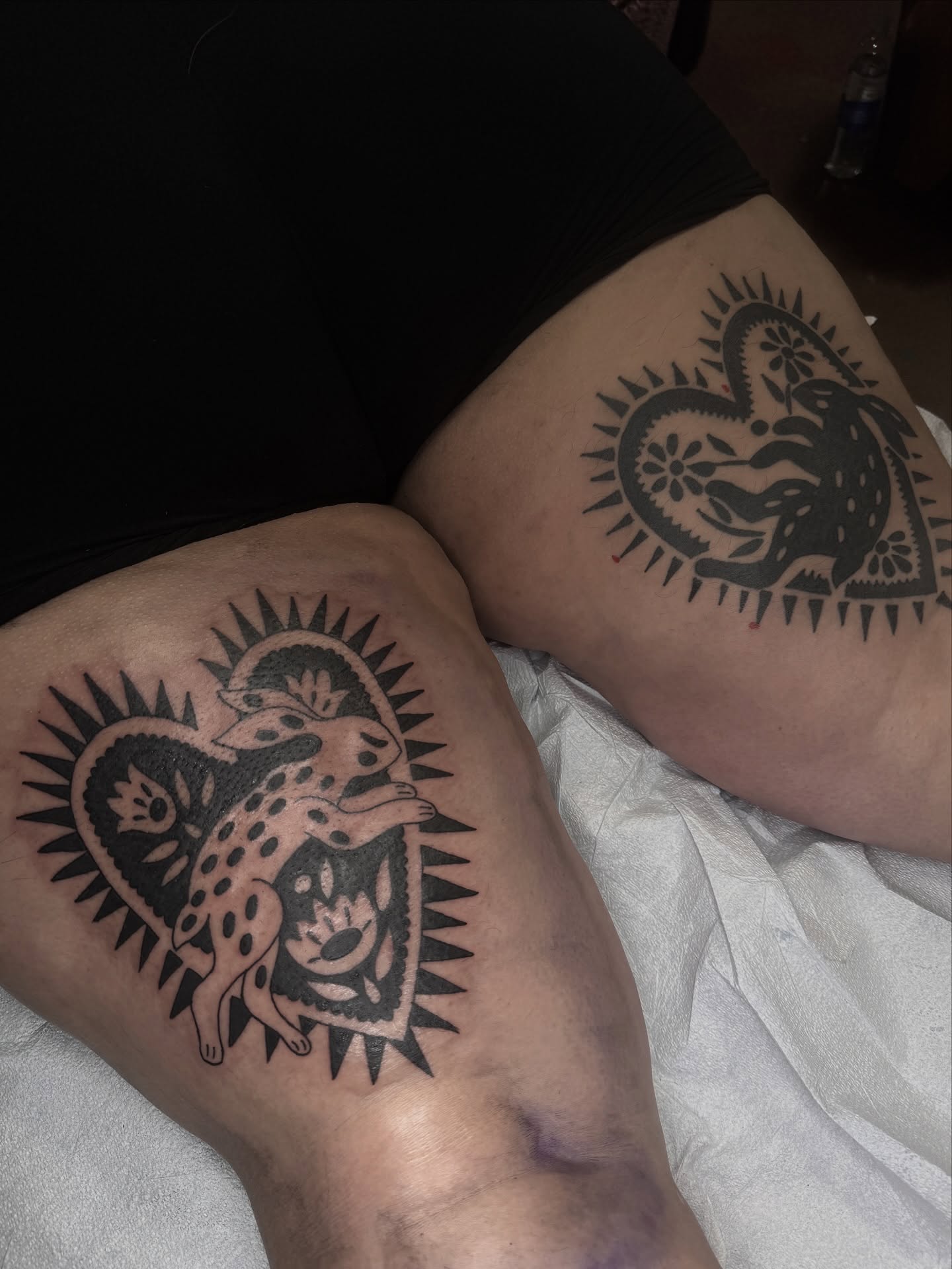 Leopard and child black and grey tattoo on the thigh by lily gustave i tattoo