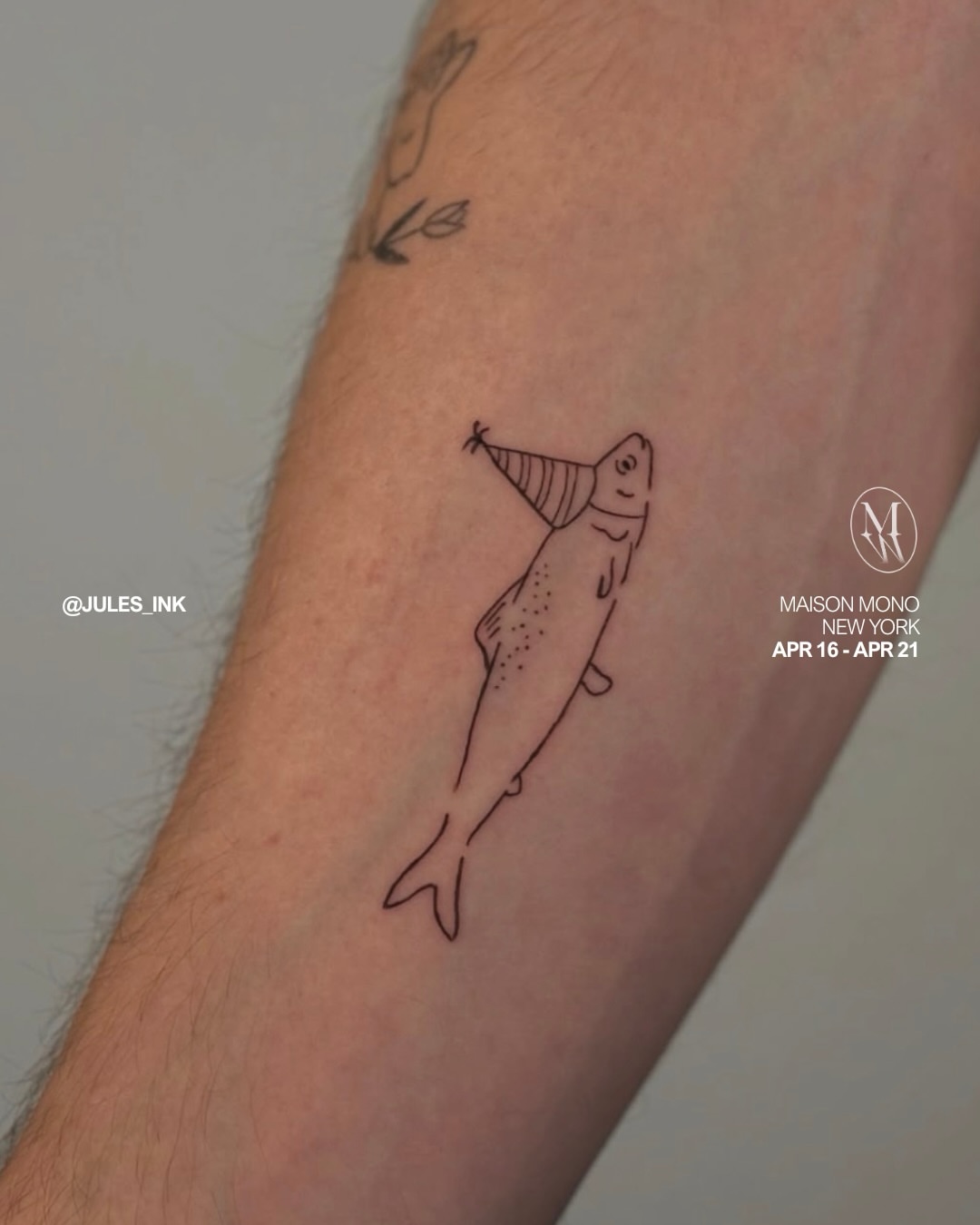 Fish with party hat fine line tattoo on the forearm by Jules Ink ⋆ Fineline Tattoo
