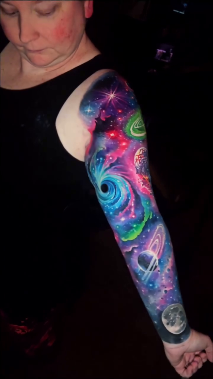 Black hole and planets realism tattoo by Tyler Malek
