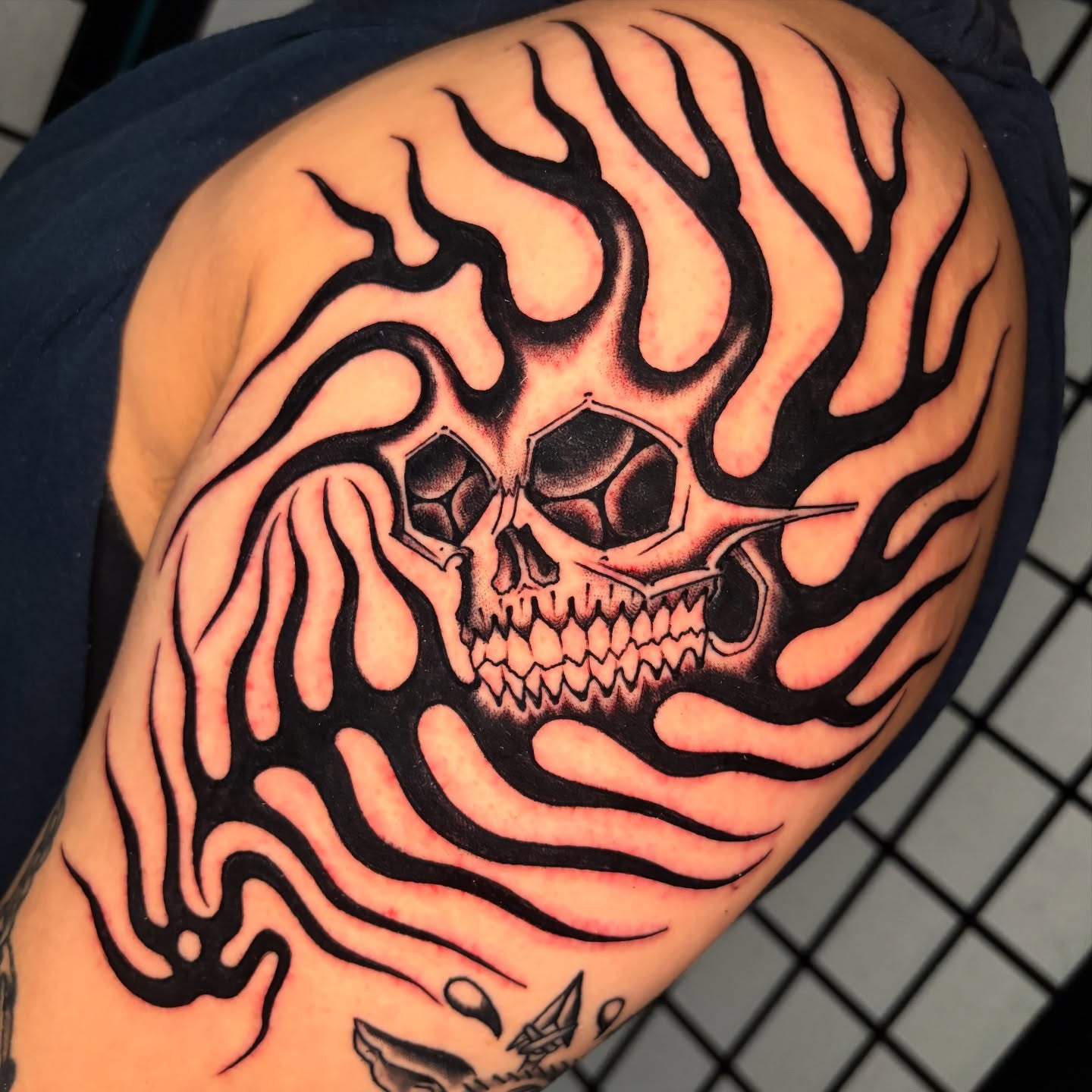 Flaming skull tribal tattoo on the shoulder by 🌴Nick Hetzel🌴, Saint Petersburg, Florida